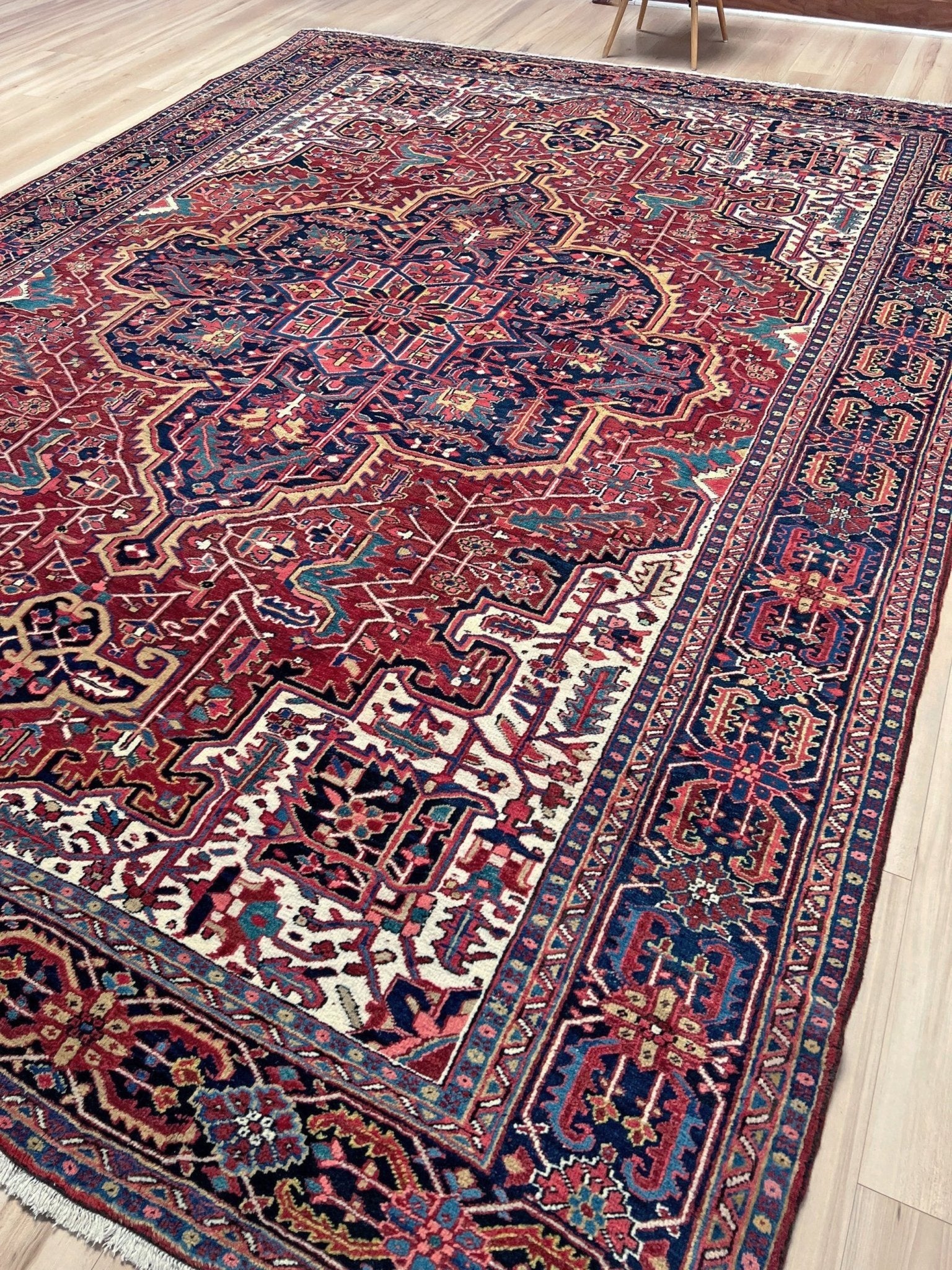 10x14 oversize handmade Persian Heriz vintage rug madder red and navy — shown in living room at Indigo Rugs, Burlingame — San Francisco Bay Area with free shipping