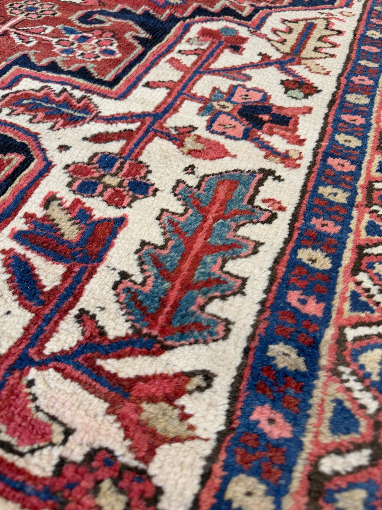 10x14 oversize handmade Persian Heriz vintage rug madder red and navy — shown in living room at Indigo Rugs, Burlingame — San Francisco Bay Area with free shipping