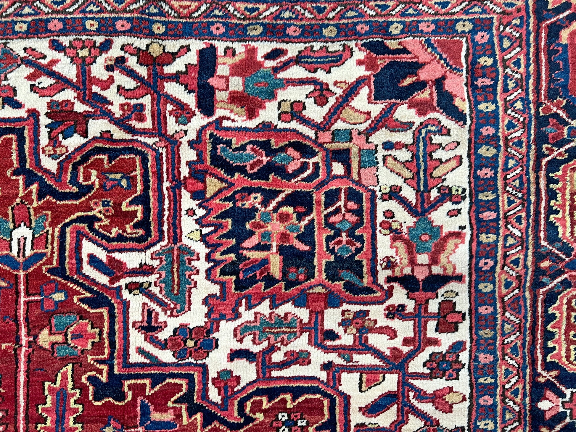 10x14 oversize handmade Persian Heriz vintage rug madder red and navy — shown in living room at Indigo Rugs, Burlingame — San Francisco Bay Area with free shipping