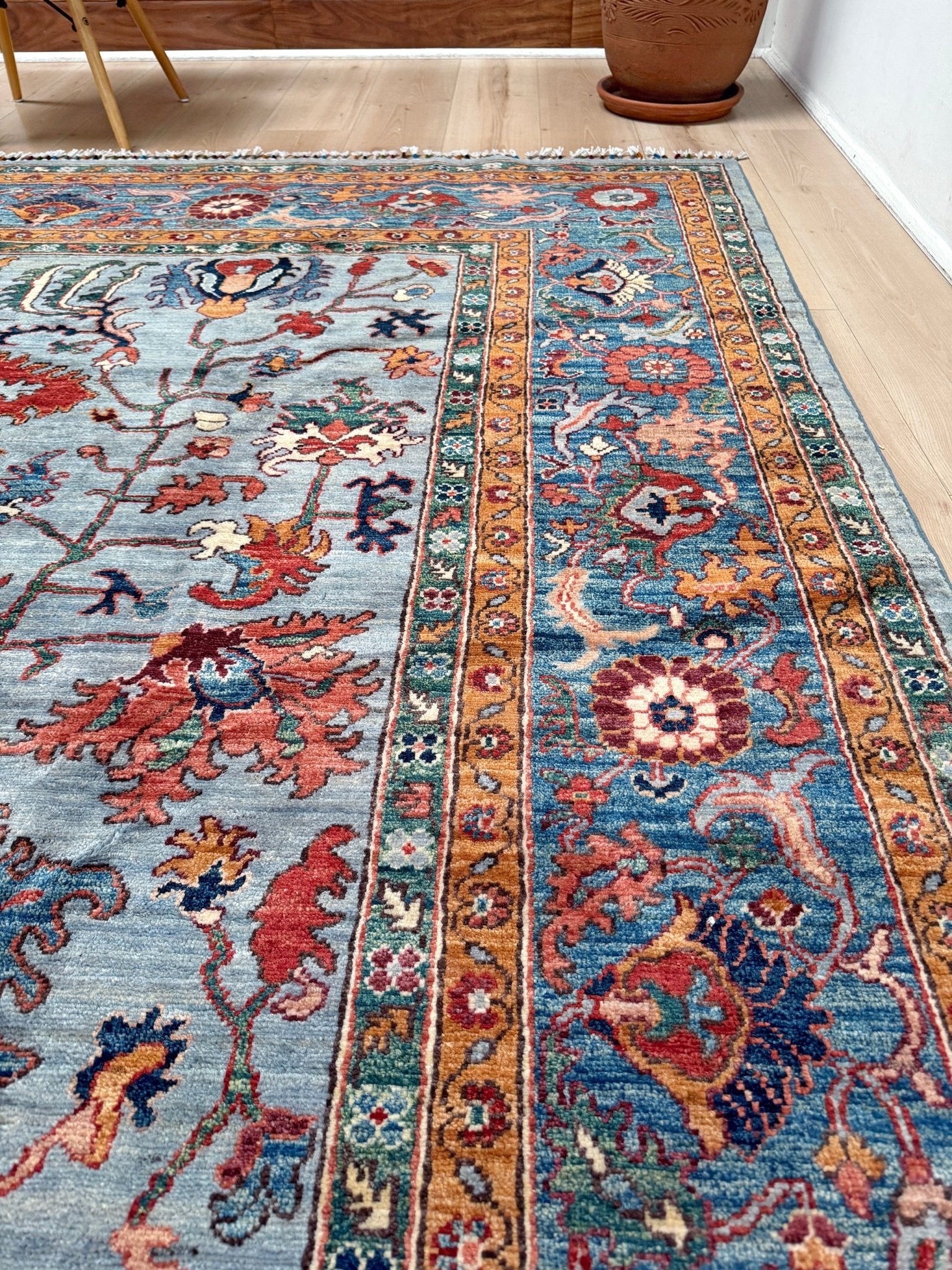 9x12 handmade luxury floral rug with dusty blue background and rich cobalt border, exclusive to the best rug shop in Burlingame CA, SF Bay Area – perfect for bedroom, living room, or dining room décor, with free shipping included.