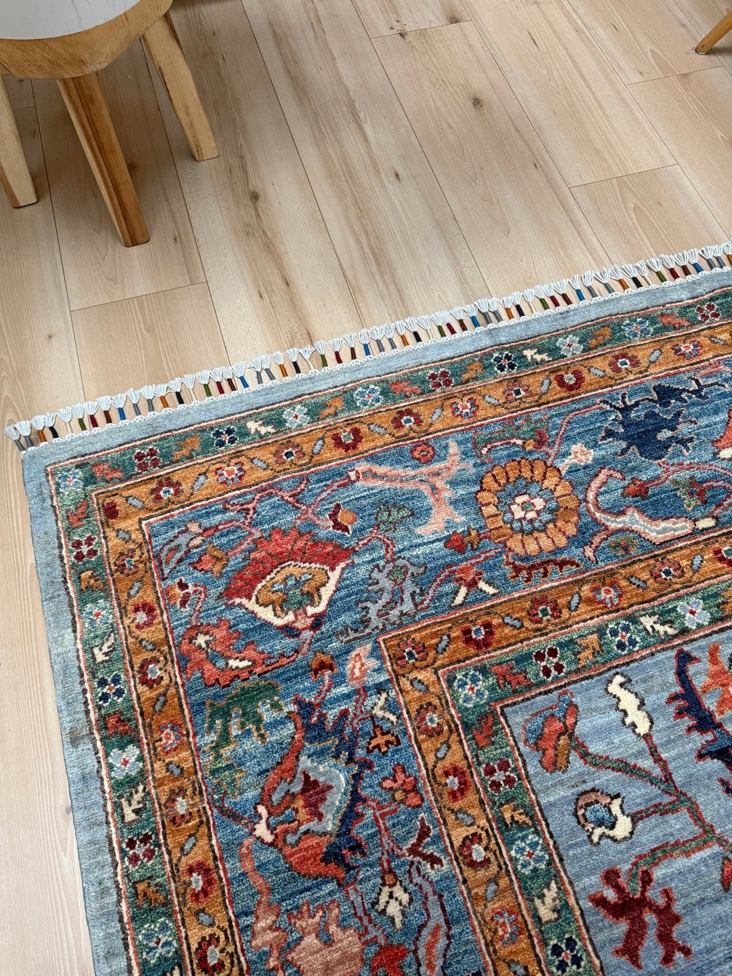 9x12 handmade luxury floral rug with dusty blue background and rich cobalt border, exclusive to the best rug shop in Burlingame CA, SF Bay Area – perfect for bedroom, living room, or dining room décor, with free shipping included.