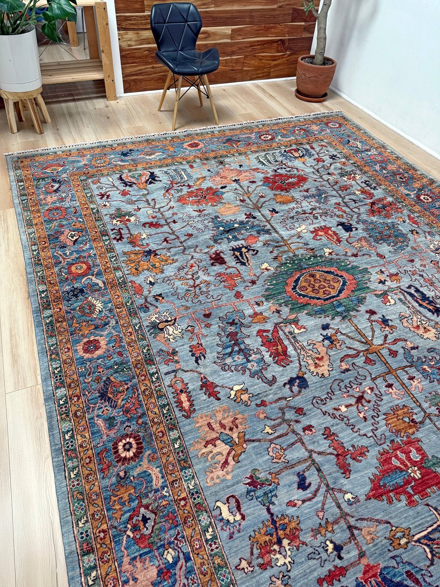 9x12 handmade luxury floral rug with dusty blue background and rich cobalt border, exclusive to the best rug shop in Burlingame CA, SF Bay Area – perfect for bedroom, living room, or dining room décor, with free shipping included.