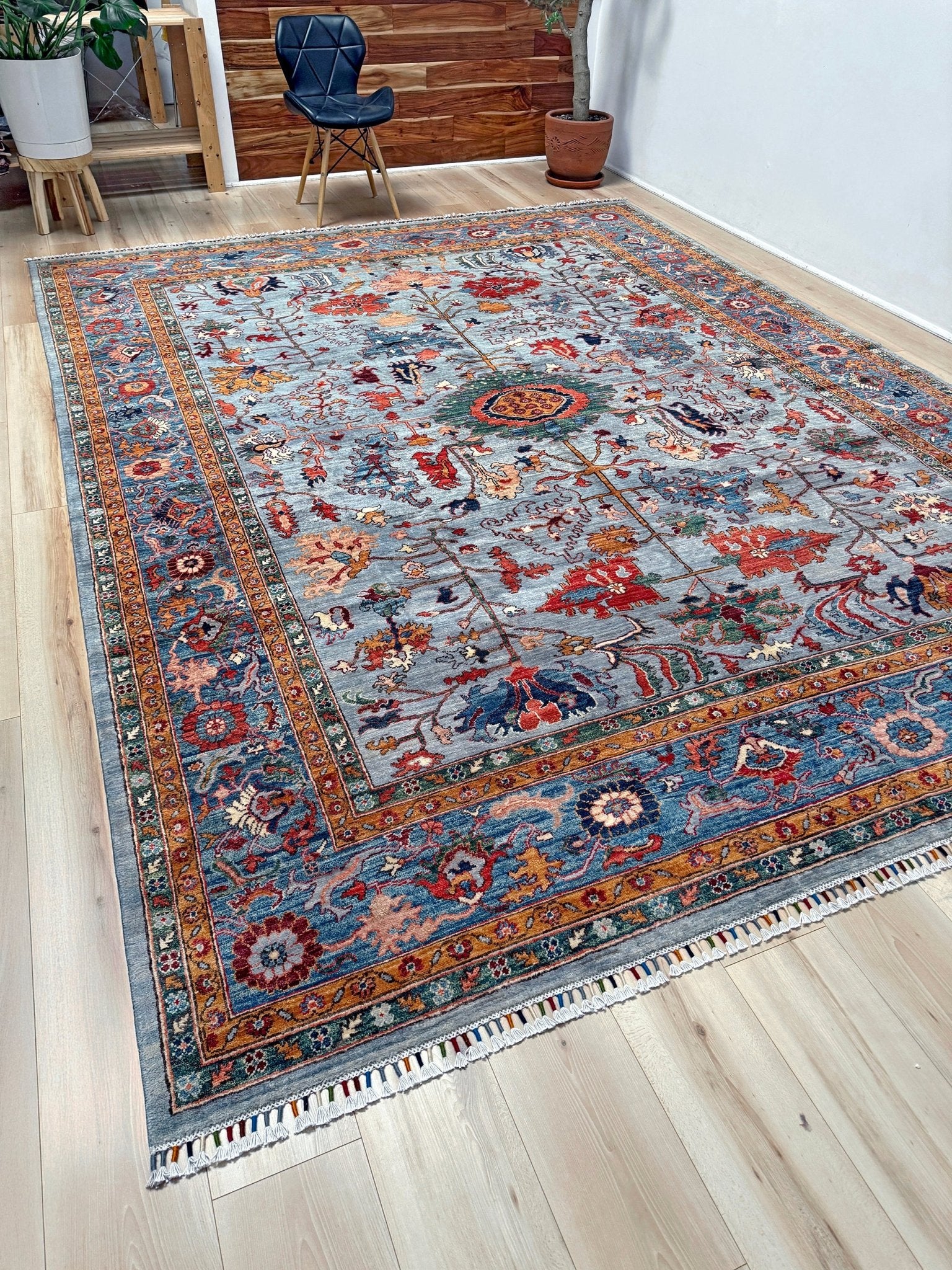 9x12 handmade luxury floral rug with dusty blue background and rich cobalt border, exclusive to the best rug shop in San Mateo, SF Bay Area – perfect for bedroom, living room, or dining room décor, with free shipping included.