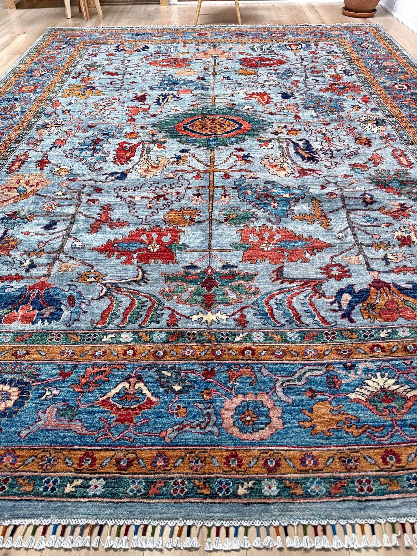 9x12 handmade luxury floral rug with dusty blue background and rich cobalt border, exclusive to the best rug shop in San Mateo, SF Bay Area – perfect for bedroom, living room, or dining room décor, with free shipping included.