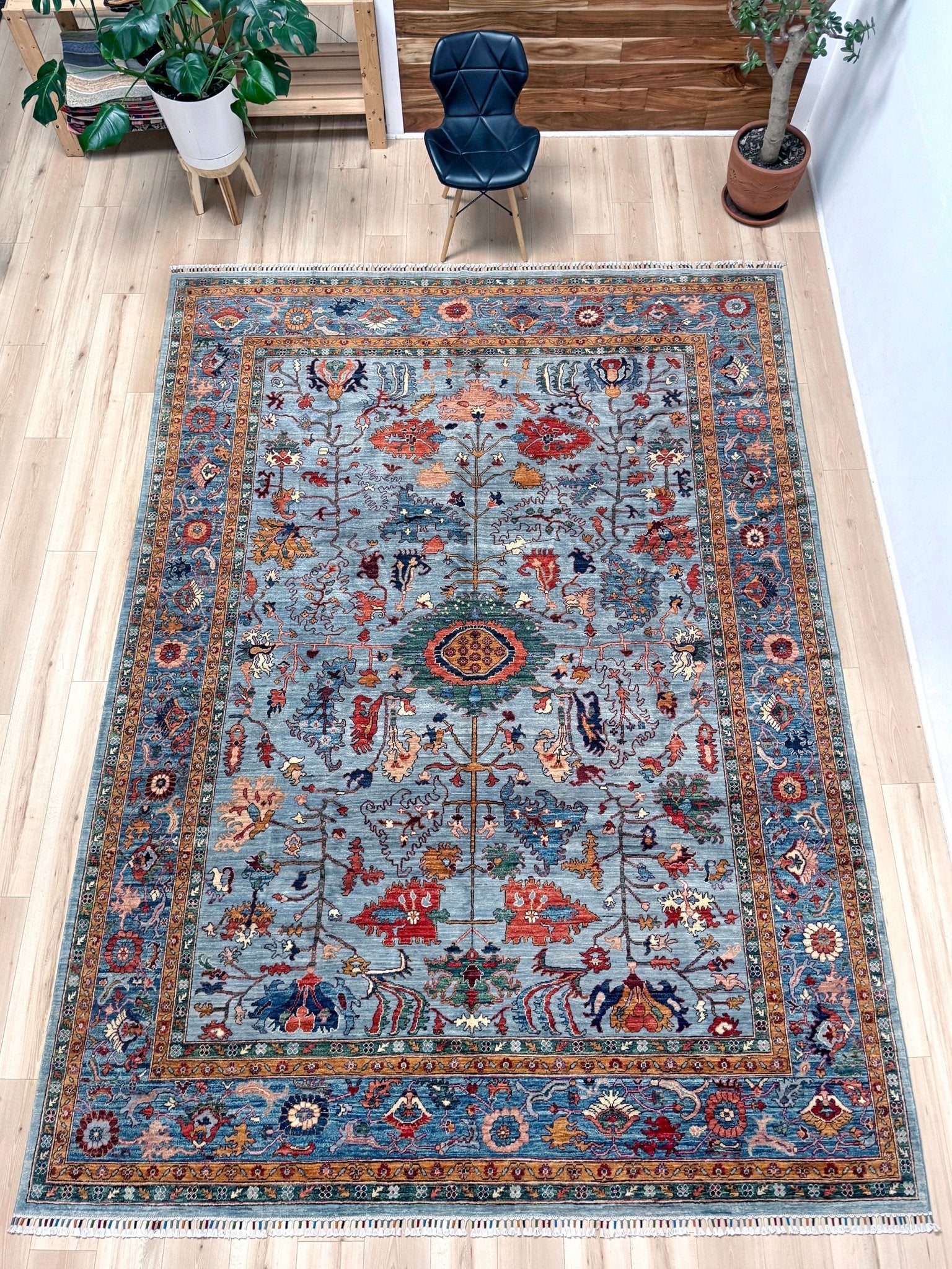 9x12 handmade luxury floral rug with dusty blue background and rich cobalt border, exclusive to the best rug shop in San Mateo, SF Bay Area – perfect for bedroom, living room, or dining room décor, with free shipping included.