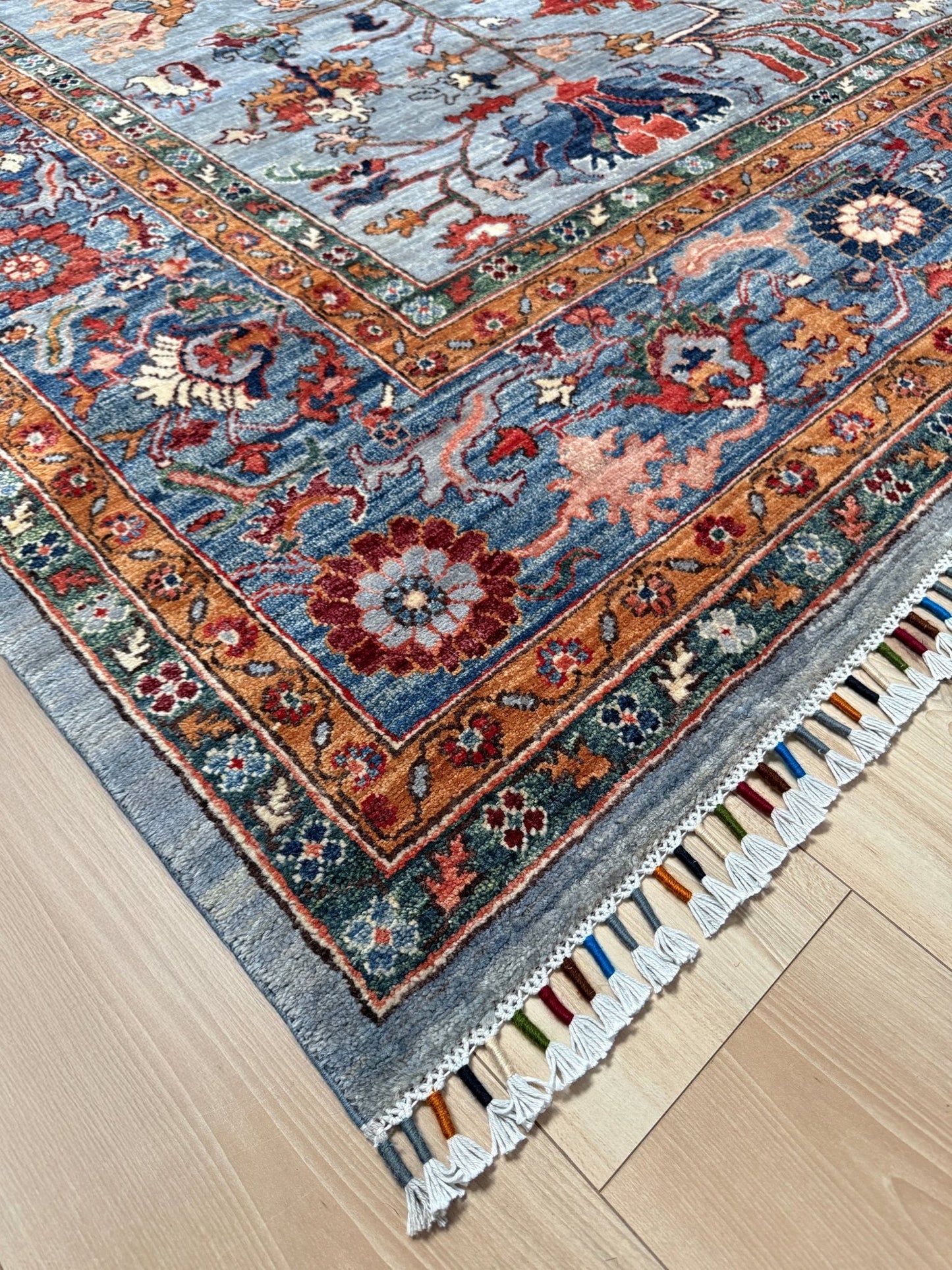 9x12 handmade luxury floral rug with dusty blue background and rich cobalt border, exclusive to the best rug shop in Burlingame CA, SF Bay Area – perfect for bedroom, living room, or dining room décor, with free shipping included.