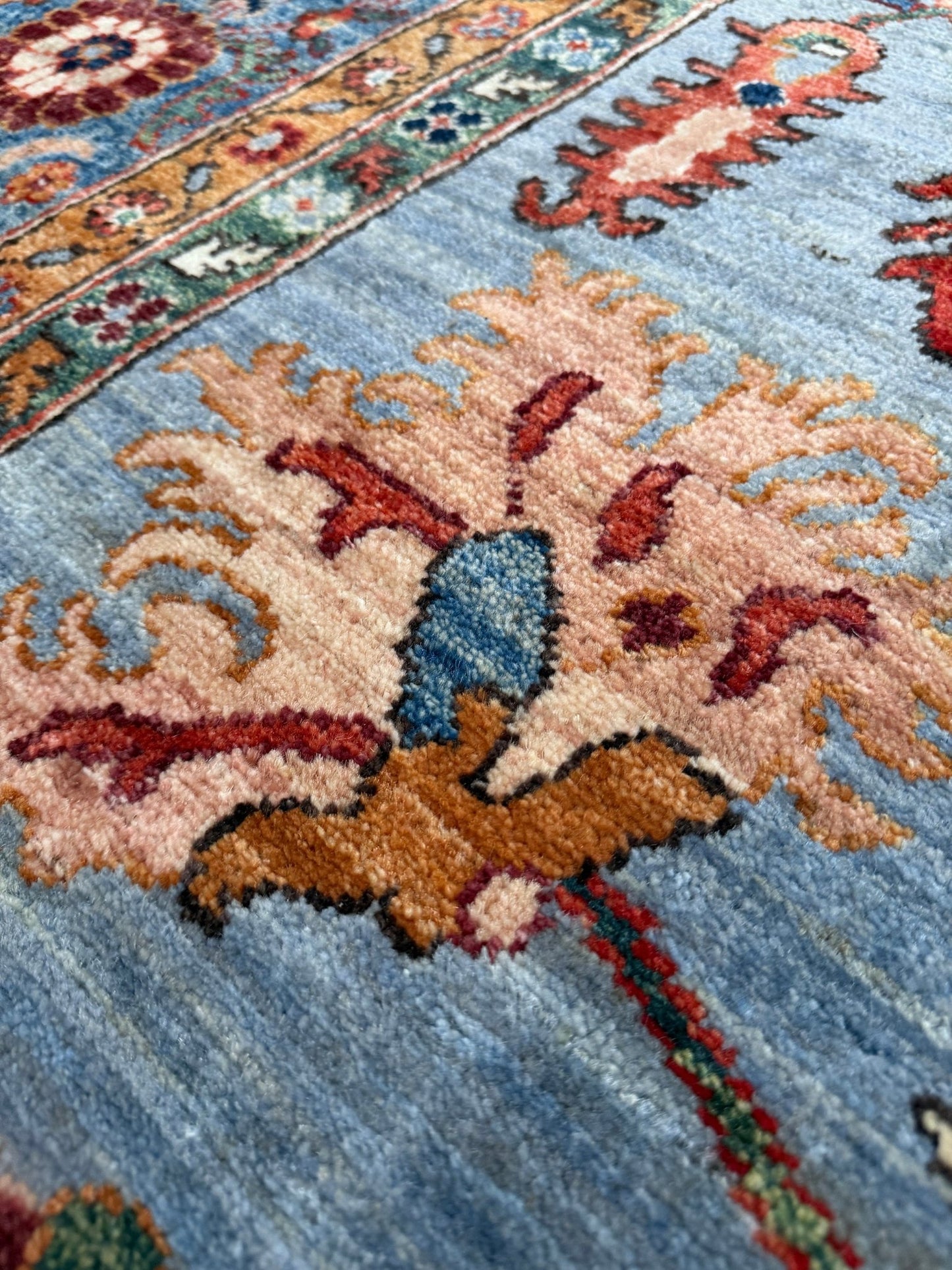 9x12 handmade luxury floral rug with dusty blue background and rich cobalt border, exclusive to the best rug shop in Burlingame CA, SF Bay Area – perfect for bedroom, living room, or dining room décor, with free shipping included.