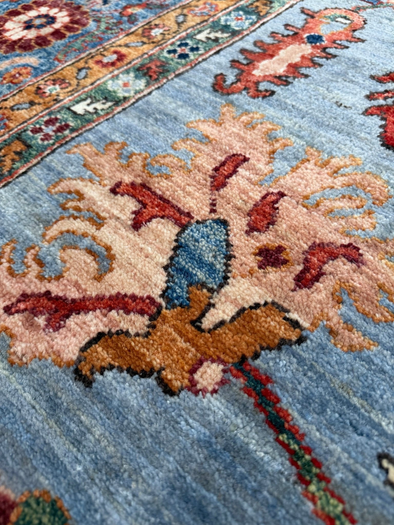 9x12 handmade luxury floral rug with dusty blue background and rich cobalt border, exclusive to the best rug shop in Burlingame CA, SF Bay Area – perfect for bedroom, living room, or dining room décor, with free shipping included.