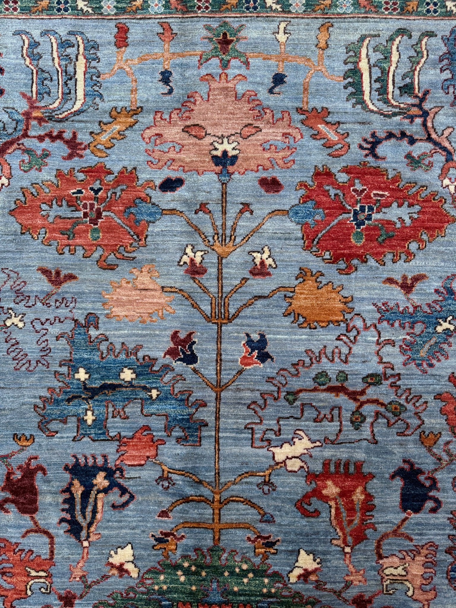 9x12 handmade luxury floral rug with dusty blue background and rich cobalt border, exclusive to the best rug shop in Burlingame CA, SF Bay Area – perfect for bedroom, living room, or dining room décor, with free shipping included.