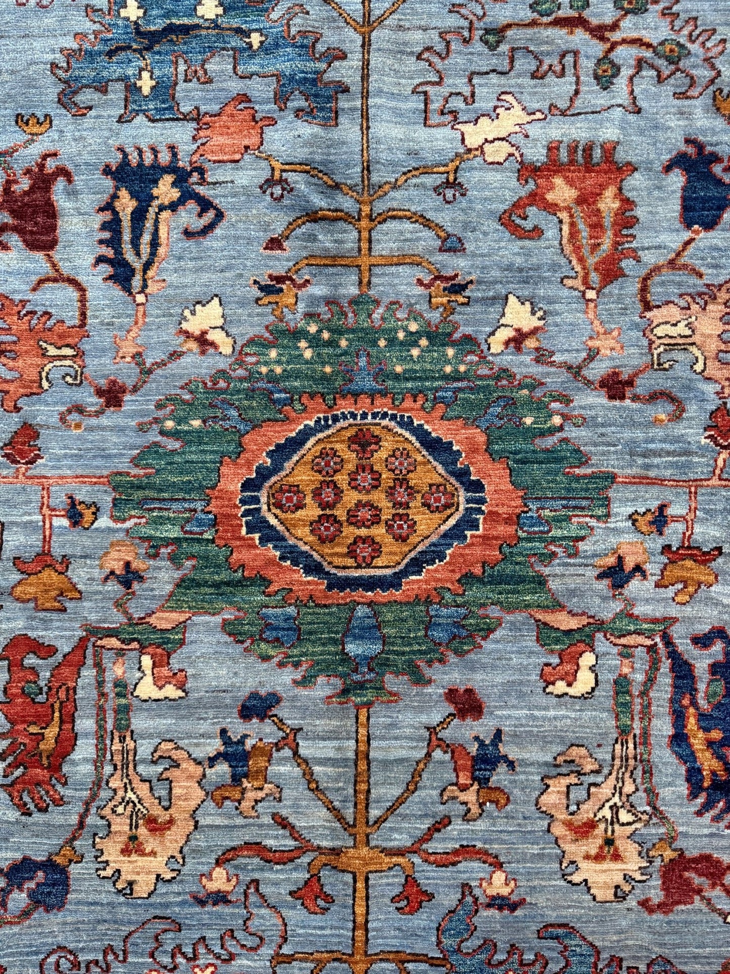 9x12 handmade luxury floral rug with dusty blue background and rich cobalt border, exclusive to the best rug shop in Burlingame CA, SF Bay Area – perfect for bedroom, living room, or dining room décor, with free shipping included.