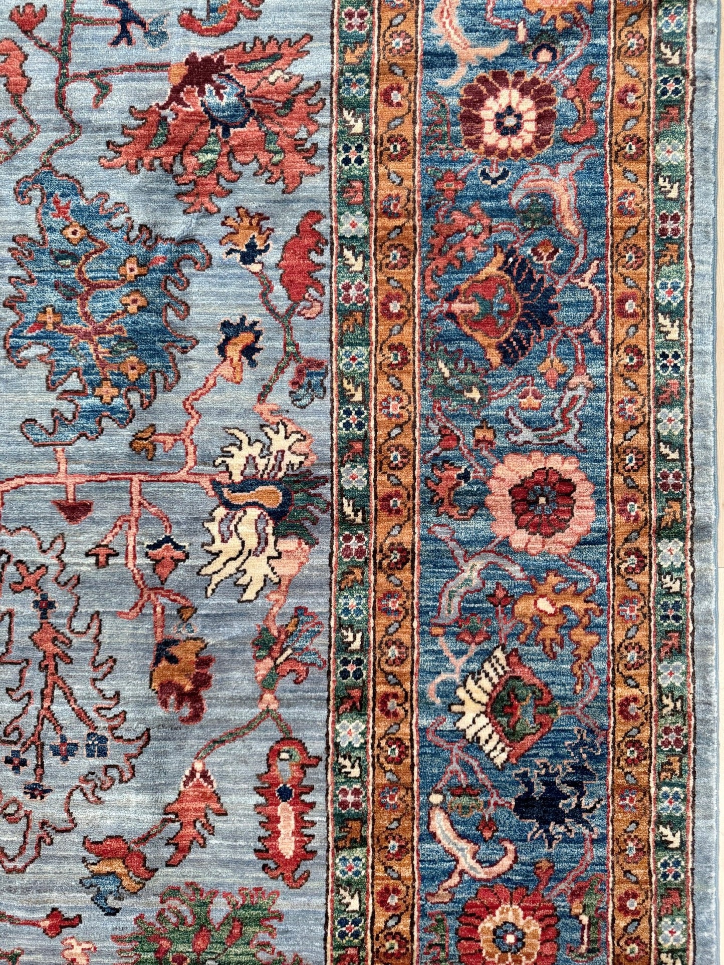 9x12 handmade luxury floral rug with dusty blue background and rich cobalt border, exclusive to the best rug shop in Burlingame CA, SF Bay Area – perfect for bedroom, living room, or dining room décor, with free shipping included.