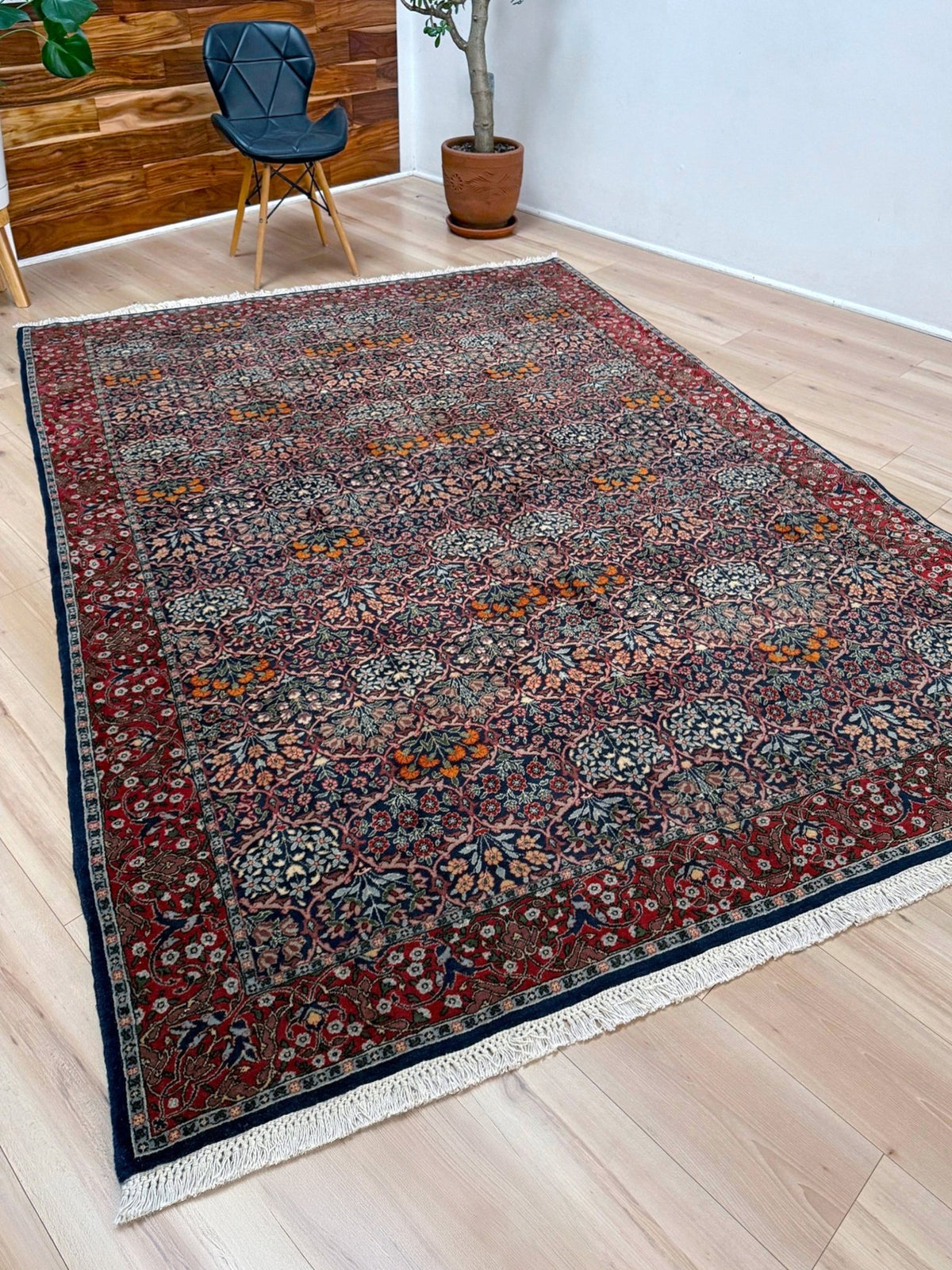 Vintage 7x9 Watermelon Hereke Turkish floral rug with midnight blue field, maroon border. Perfect for living rooms, dining spaces, or bedrooms. From the best rug shop in Burlingame, San Francisco Bay Area, CA