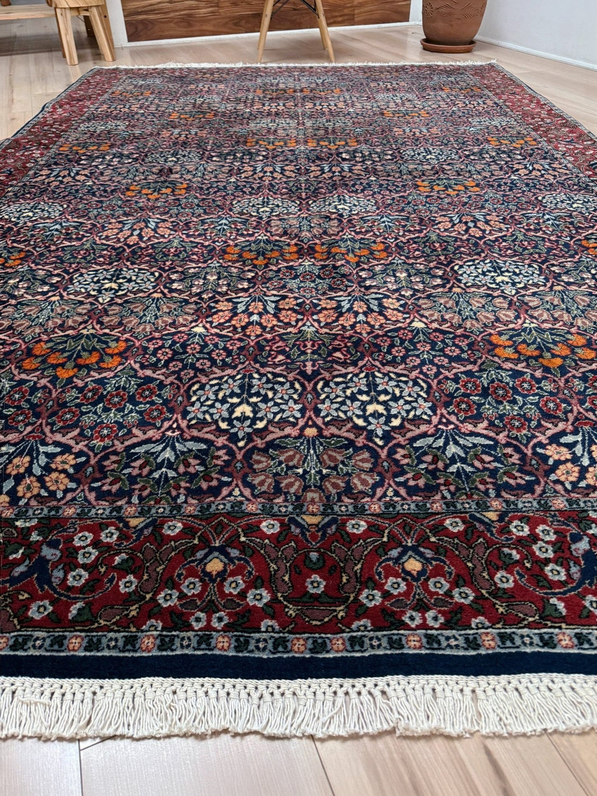 Vintage 7x9 Watermelon Hereke Turkish floral rug with midnight blue field, maroon border. Perfect for living rooms, dining spaces, or bedrooms. From the best rug shop in Burlingame, San Francisco Bay Area, CA