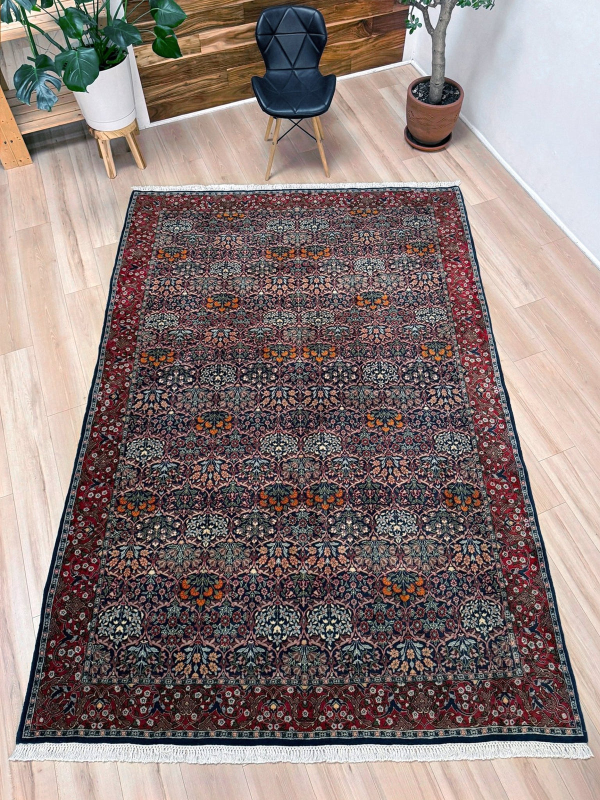 Vintage 7x9 Watermelon Hereke Turkish floral rug with midnight blue field, maroon border. Perfect for living rooms, dining spaces, or bedrooms. From the best rug shop in Burlingame, San Francisco Bay Area, CA
