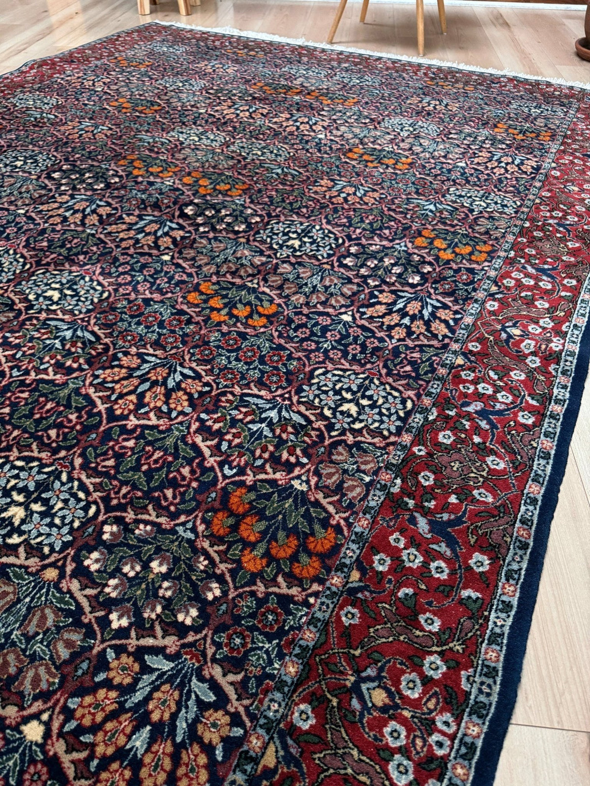 Vintage 7x9 Watermelon Hereke Turkish floral rug with midnight blue field, maroon border. Perfect for living rooms, dining spaces, or bedrooms. From the best rug shop in Burlingame, San Francisco Bay Area, CA