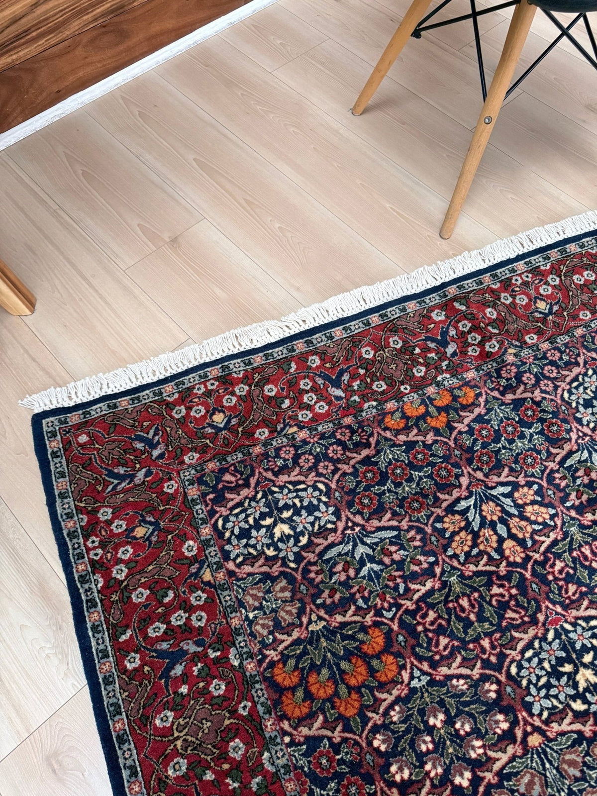 Vintage 7x9 Watermelon Hereke Turkish floral rug with midnight blue field, maroon border. Perfect for living rooms, dining spaces, or bedrooms. From the best rug shop in Burlingame, San Francisco Bay Area, CA