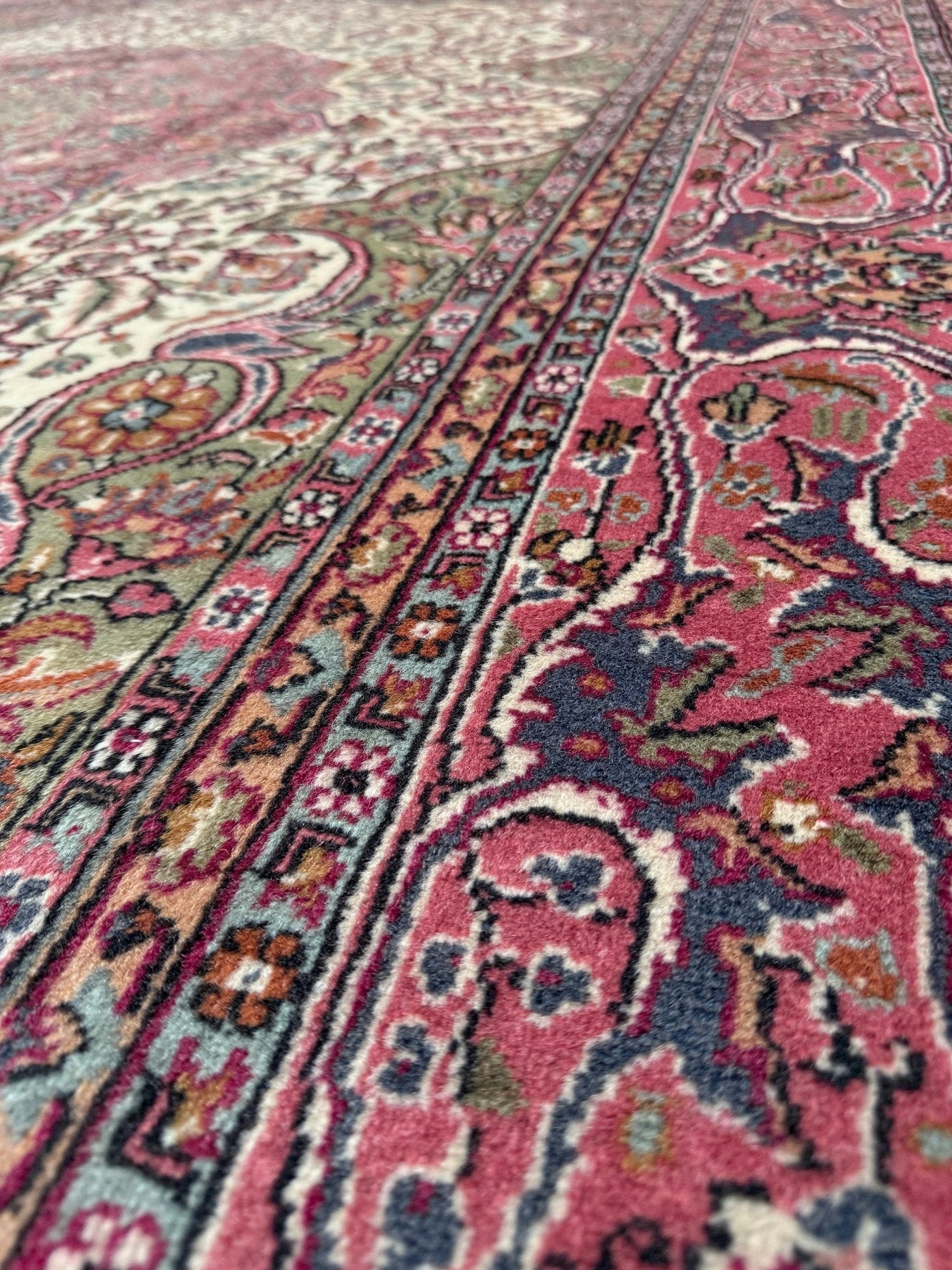 Pink and brown vintage Turkish rug. This luxurious 9x12 handmade wool carpet is available in Burlingame CA SF Bay Area with free shipping, perfect for adding a touch of elegance to any home decor.