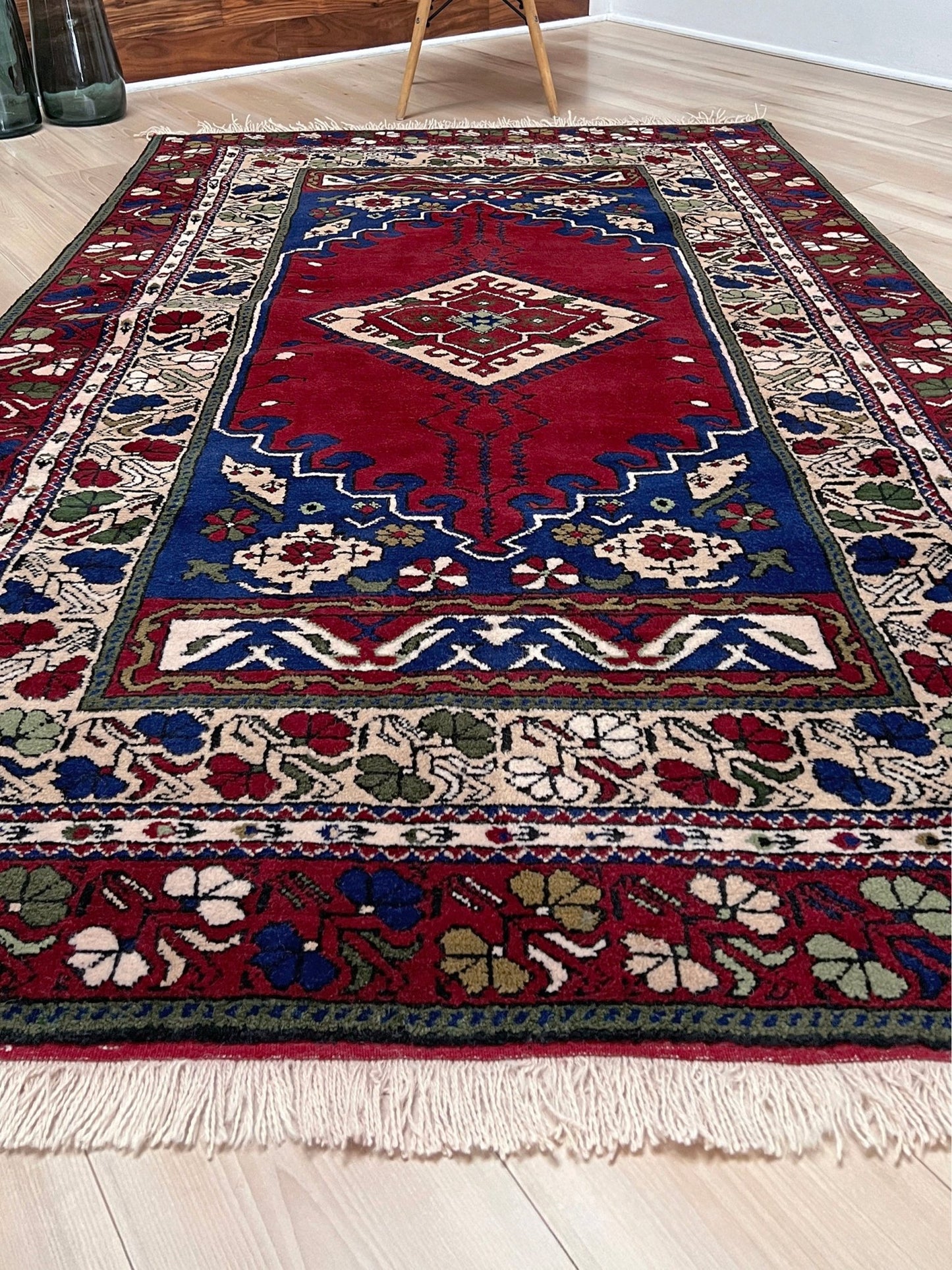 crimson red vibrant anatolian turkish vintage rug 5x7 traditional handmade village wool rug blue medallion floral border plush pile indigo rugs san francisco bay area