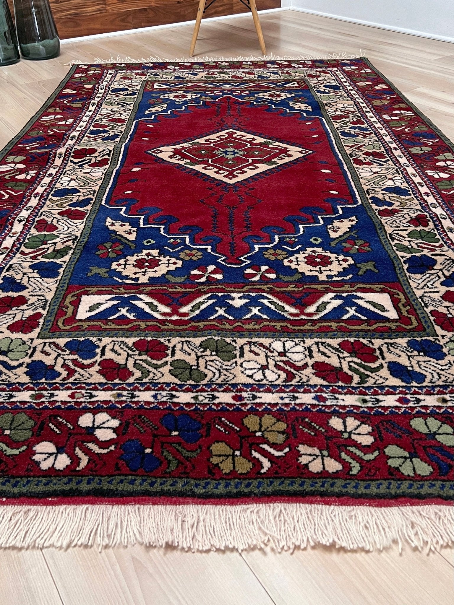 crimson red vibrant anatolian turkish vintage rug 5x7 traditional handmade village wool rug blue medallion floral border plush pile indigo rugs san francisco bay area