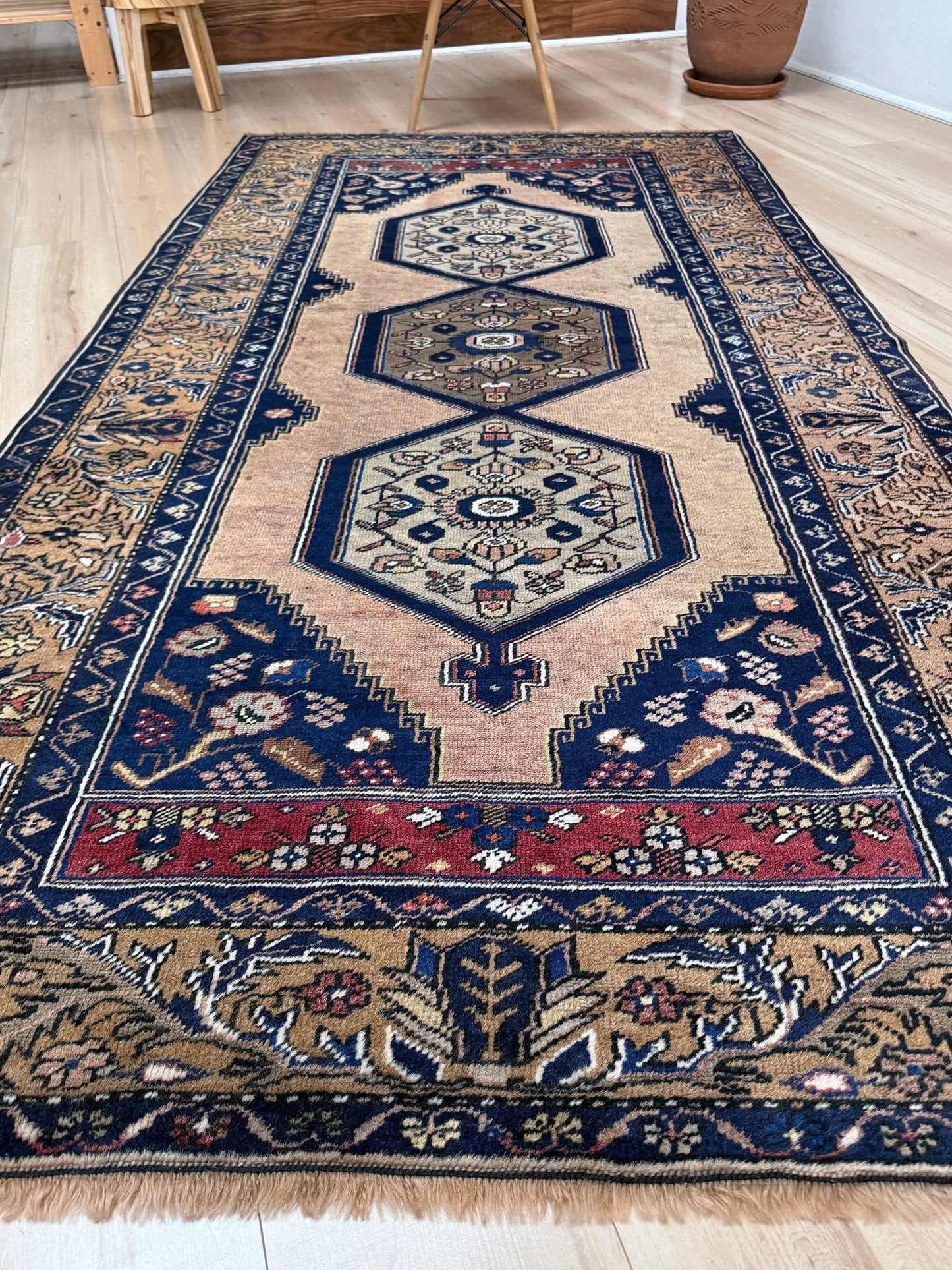 4x8 Vintage Yahyali Turkish wool rug with hexagonal medallions camel beige navy. Perfect for bedroom, living room, or kitchen. One-of-a-kind rug from Indigo Rugs in Burlingame, the best rug shop in the San Francisco Bay Area. Free shipping