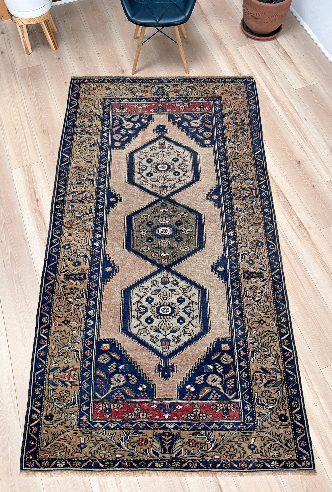 4x8 Vintage Yahyali Turkish wool rug with hexagonal medallions camel beige navy. Perfect for bedroom, living room, or kitchen. One-of-a-kind rug from Indigo Rugs in Burlingame, the best rug shop in the San Francisco Bay Area. Free shipping