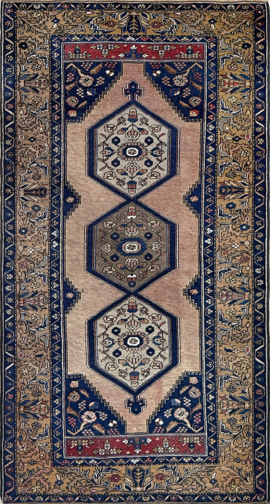 4x7 Vintage Turkish rug with hexagonal medallions, rich camel and deep indigo hues, and intricate floral borders—perfect for bedroom, living room, or dining room. High-quality rug with character from the best rug shop in San Mateo, SF Bay Area. Free shipping available.