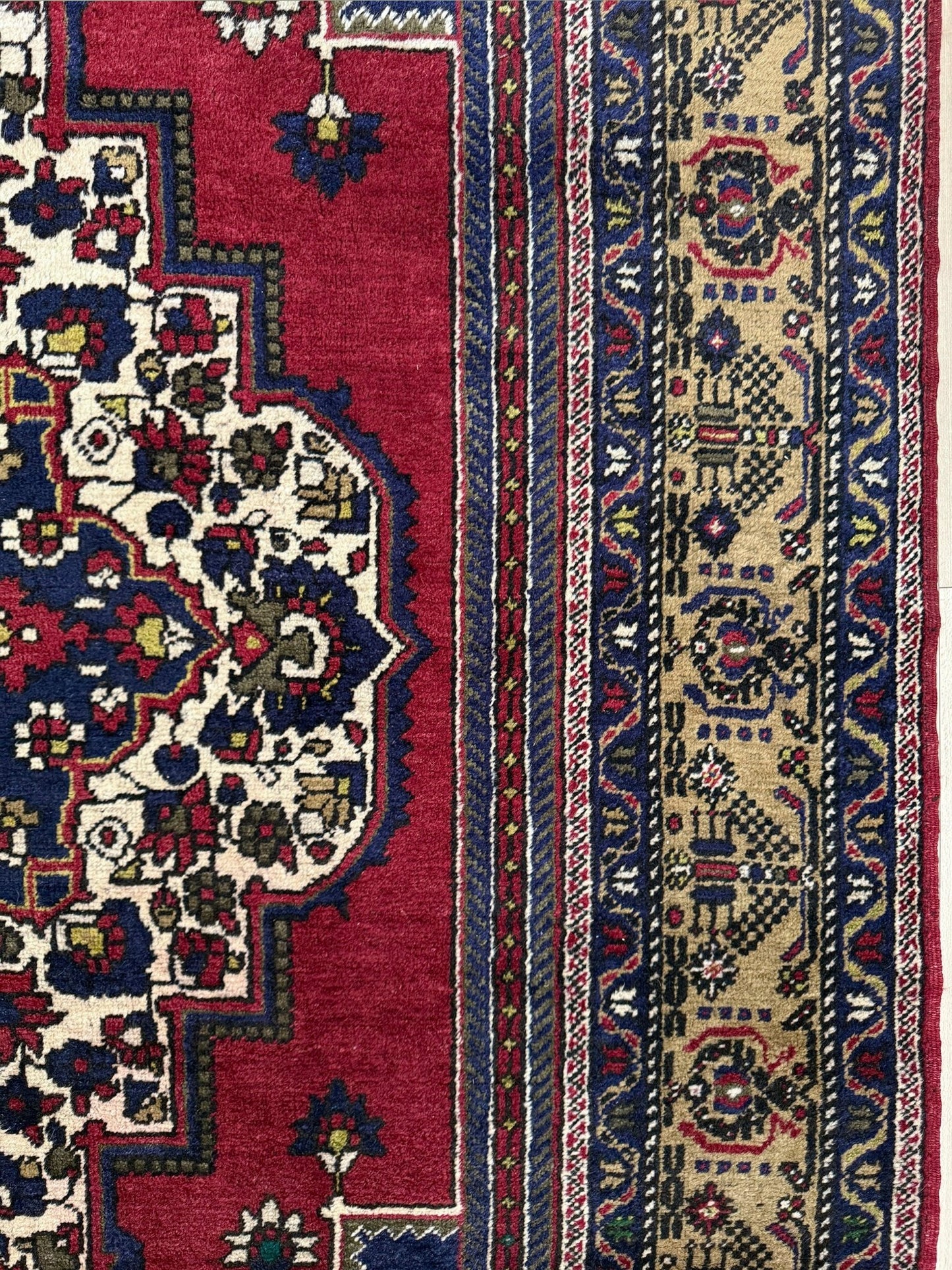 8x12 Taspinar vintage Turkish rug from the best rug shop in San Mateo, SF Bay Area, offering free shipping. This high-quality rug features rich crimson red, midnight blue, ivory, and golden beige hues, perfect for adding character to your bedroom, living room, or dining area.