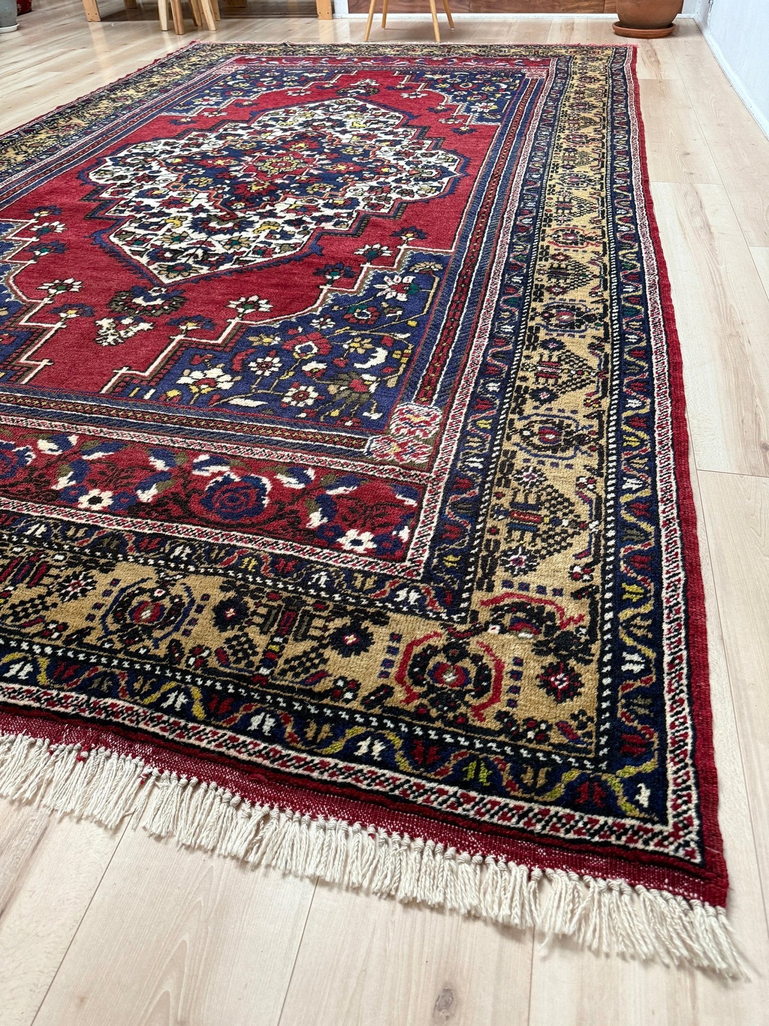 8x12 Taspinar vintage Turkish rug from the best rug shop in San Mateo, SF Bay Area, offering free shipping. This high-quality rug features rich crimson red, midnight blue, ivory, and golden beige hues, perfect for adding character to your bedroom, living room, or dining area.