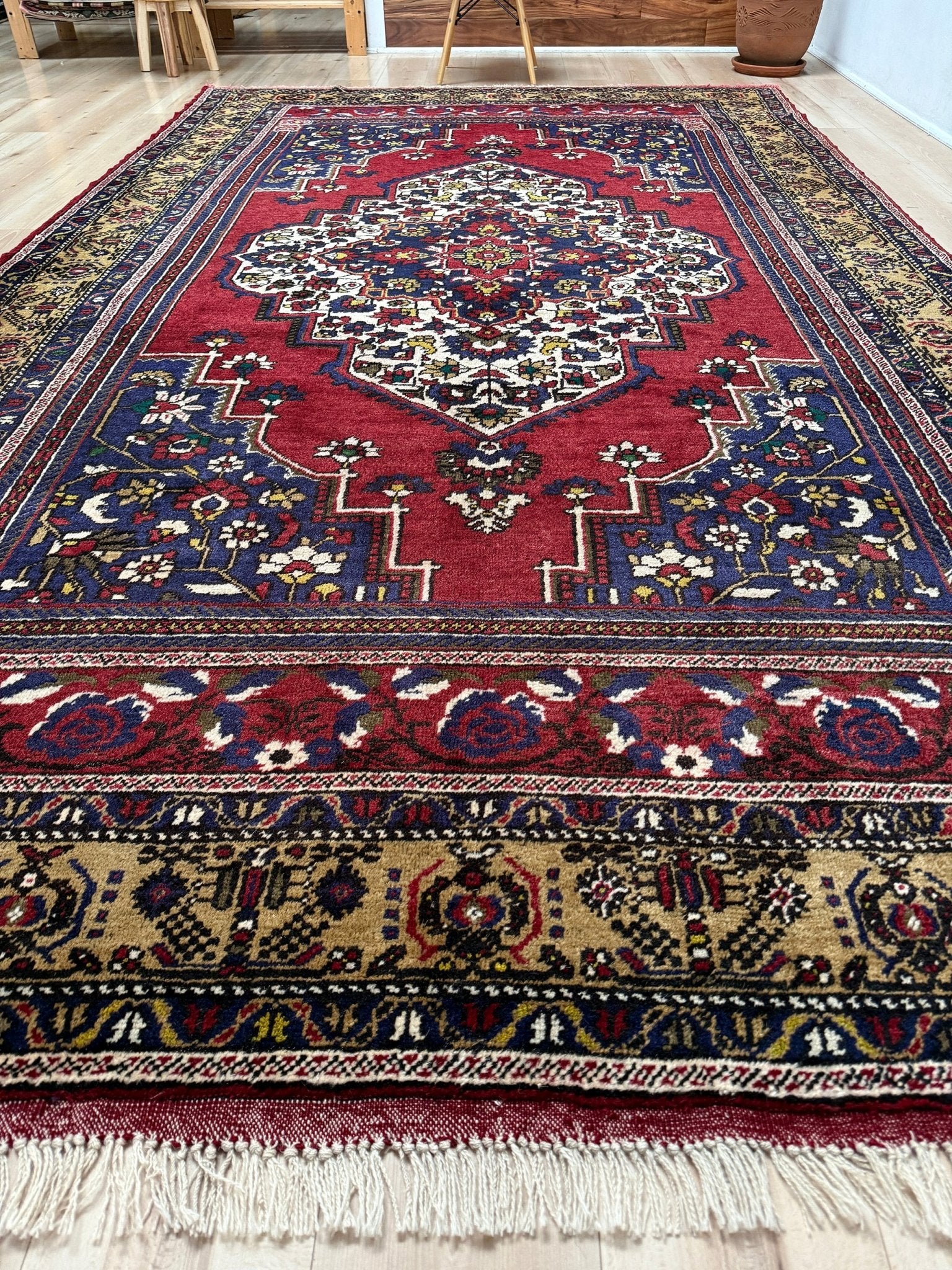 8x12 Taspinar vintage Turkish rug from the best rug shop in San Mateo, SF Bay Area, offering free shipping. This high-quality rug features rich crimson red, midnight blue, ivory, and golden beige hues, perfect for adding character to your bedroom, living room, or dining area.