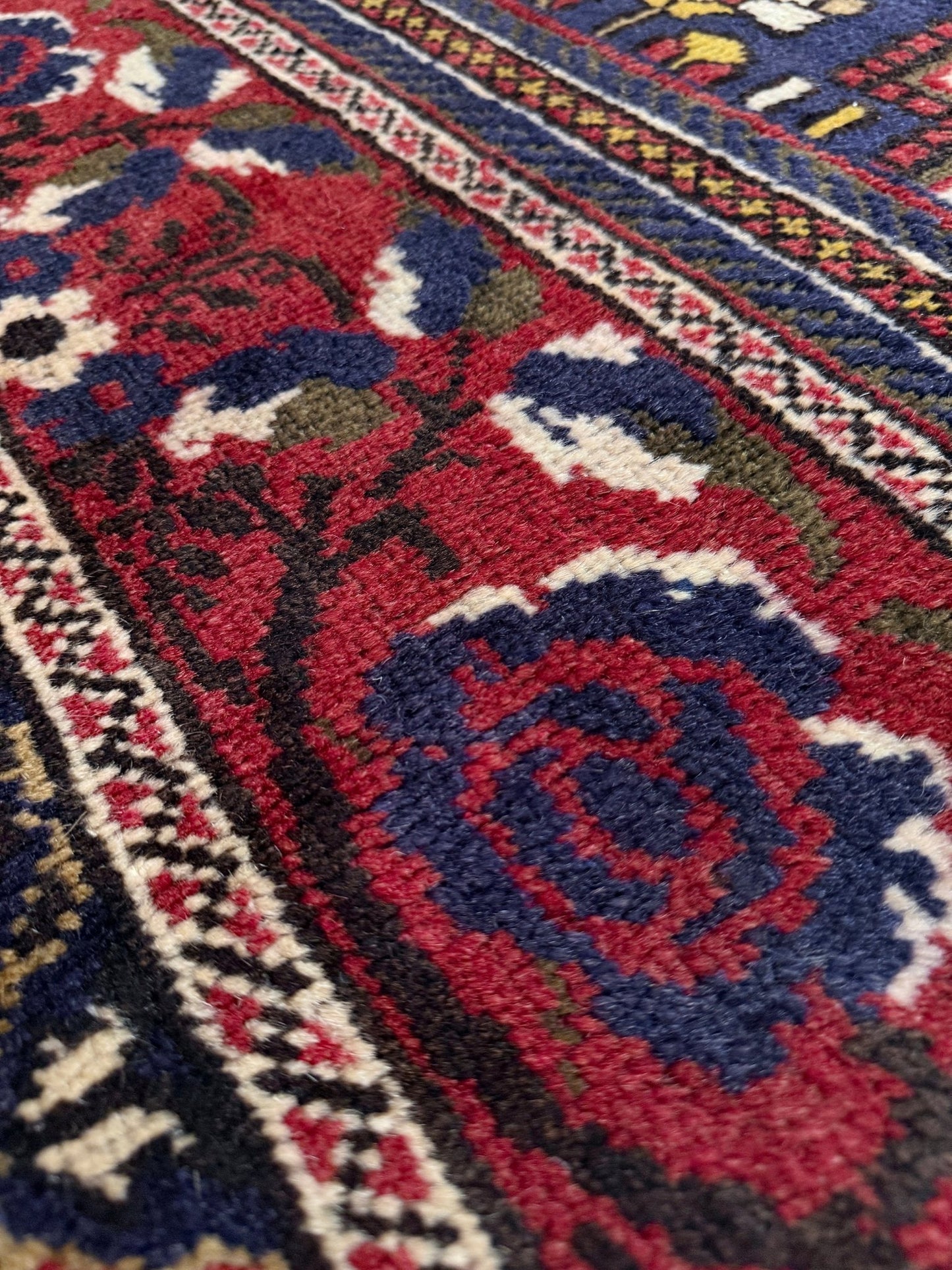8x12 Taspinar vintage Turkish rug from the best rug shop in Burlingame, SF Bay Area, offering free shipping. This high-quality rug features rich crimson red, midnight blue, ivory, and golden beige hues, perfect for adding character to your bedroom, living room, or dining area.