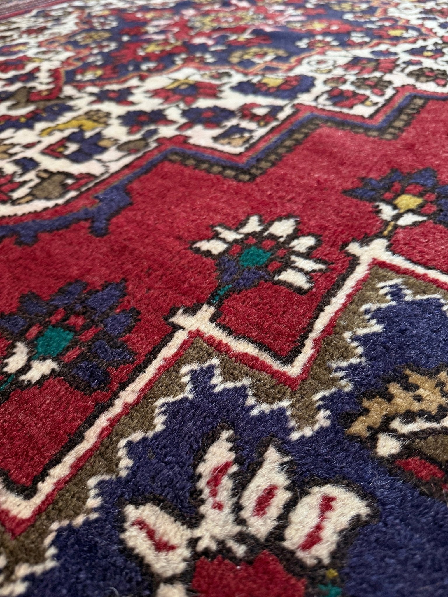 8x12 Taspinar vintage Turkish rug from the best rug shop in San Mateo, SF Bay Area, offering free shipping. This high-quality rug features rich crimson red, midnight blue, ivory, and golden beige hues, perfect for adding character to your bedroom, living room, or dining area.