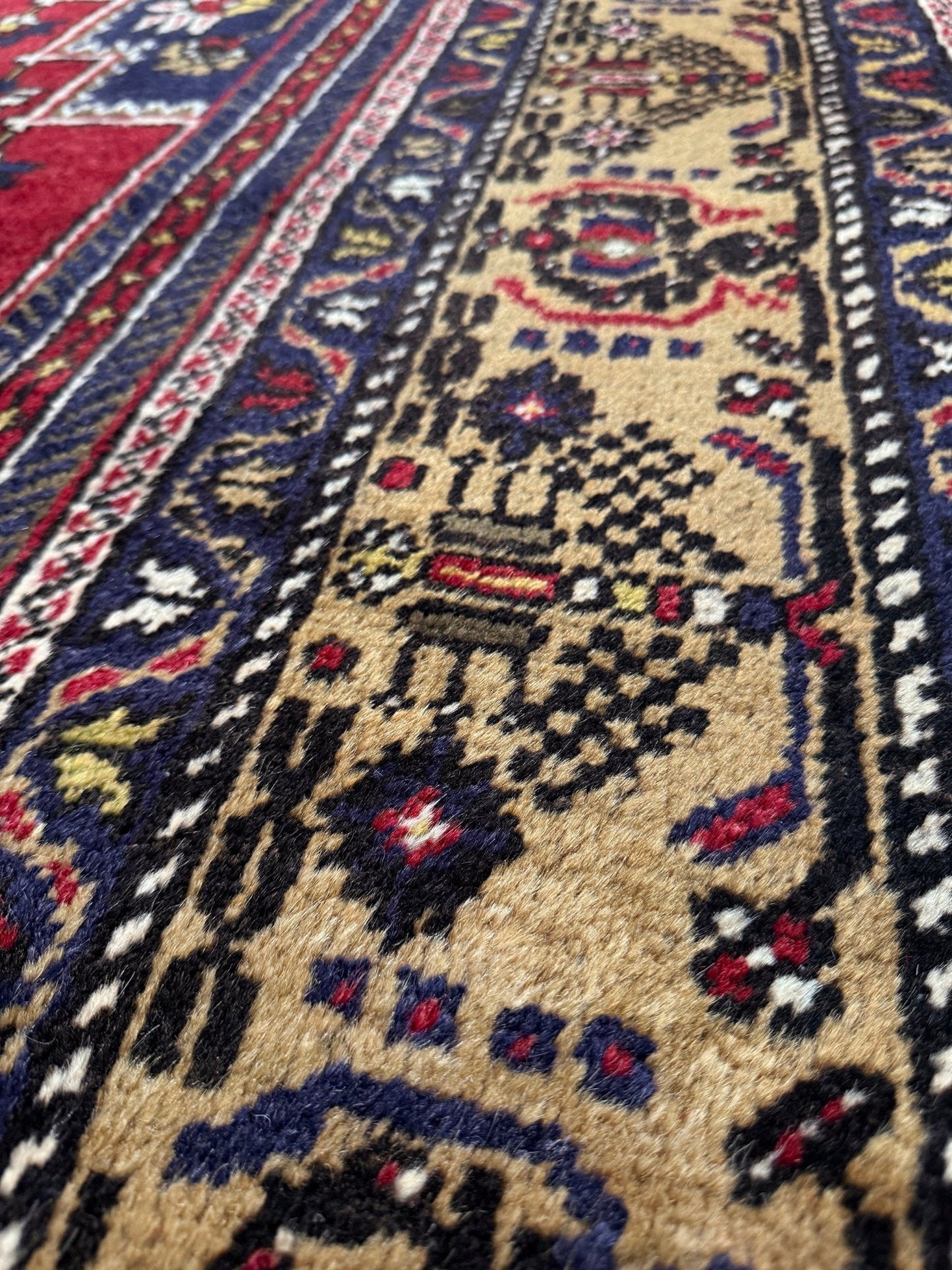 8x12 Taspinar vintage Turkish rug from the best rug shop in Burlingame, SF Bay Area, offering free shipping. This high-quality rug features rich crimson red, midnight blue, ivory, and golden beige hues, perfect for adding character to your bedroom, living room, or dining area.