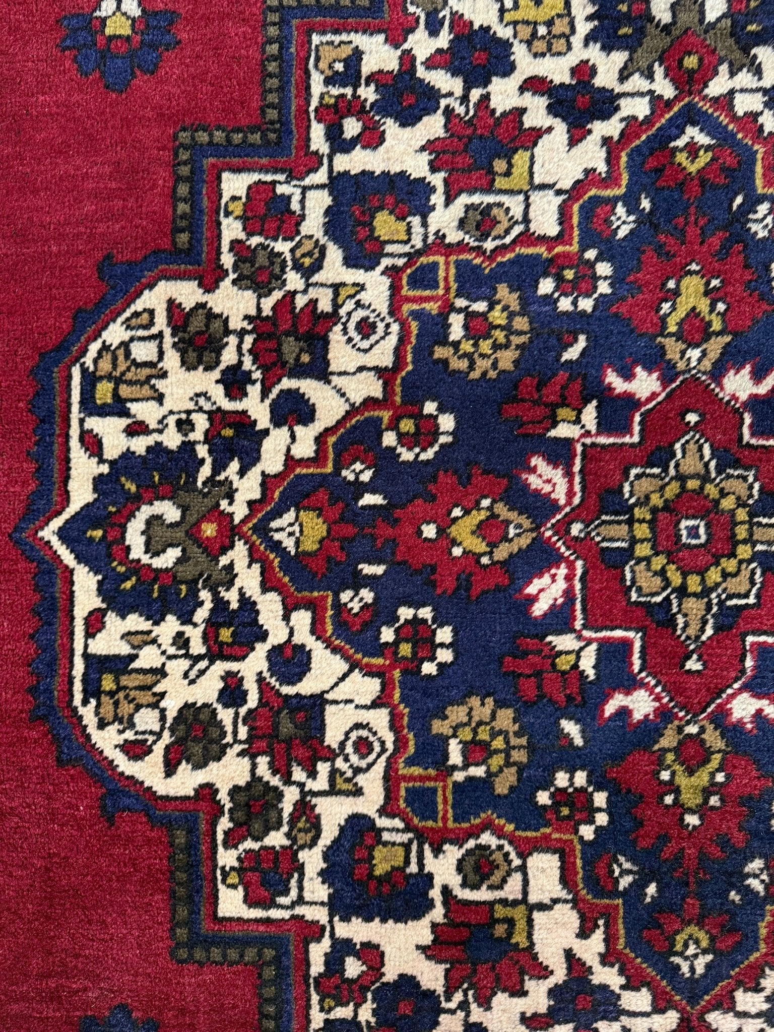 8x12 Taspinar vintage Turkish rug from the best rug shop in San Mateo, SF Bay Area, offering free shipping. This high-quality rug features rich crimson red, midnight blue, ivory, and golden beige hues, perfect for adding character to your bedroom, living room, or dining area.