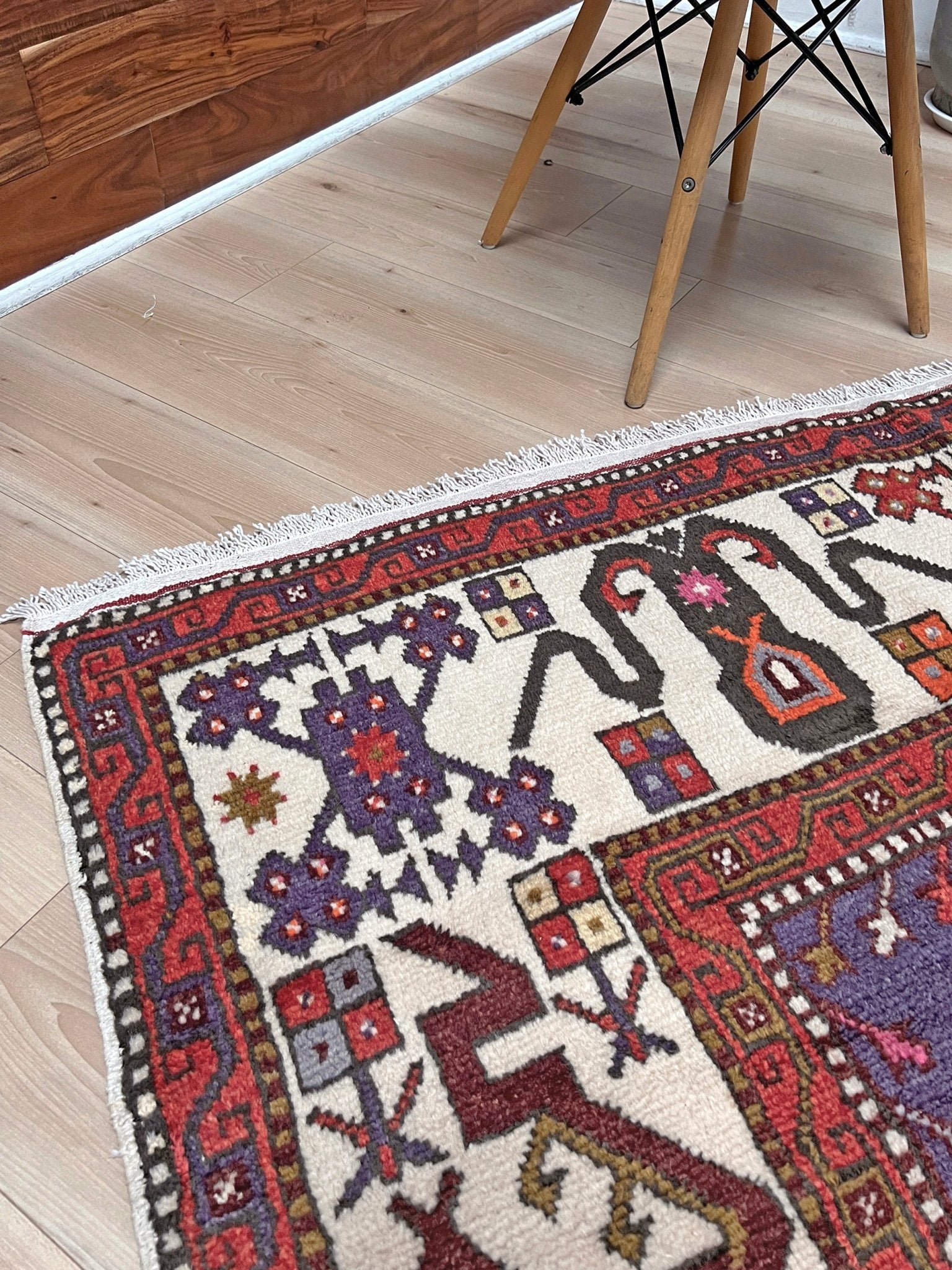 Vintage Turkish Cloudband rug with a golden olive center and bold geometric medallion, surrounded by plum, burgundy, periwinkle, and ivory tribal motifs. Handmade Colorful Vibrant Anatolian wool rug, 6x9 , perfect for living rooms or bedrooms. From Indigo Rugs, Burlingame — San Francisco Bay Area.