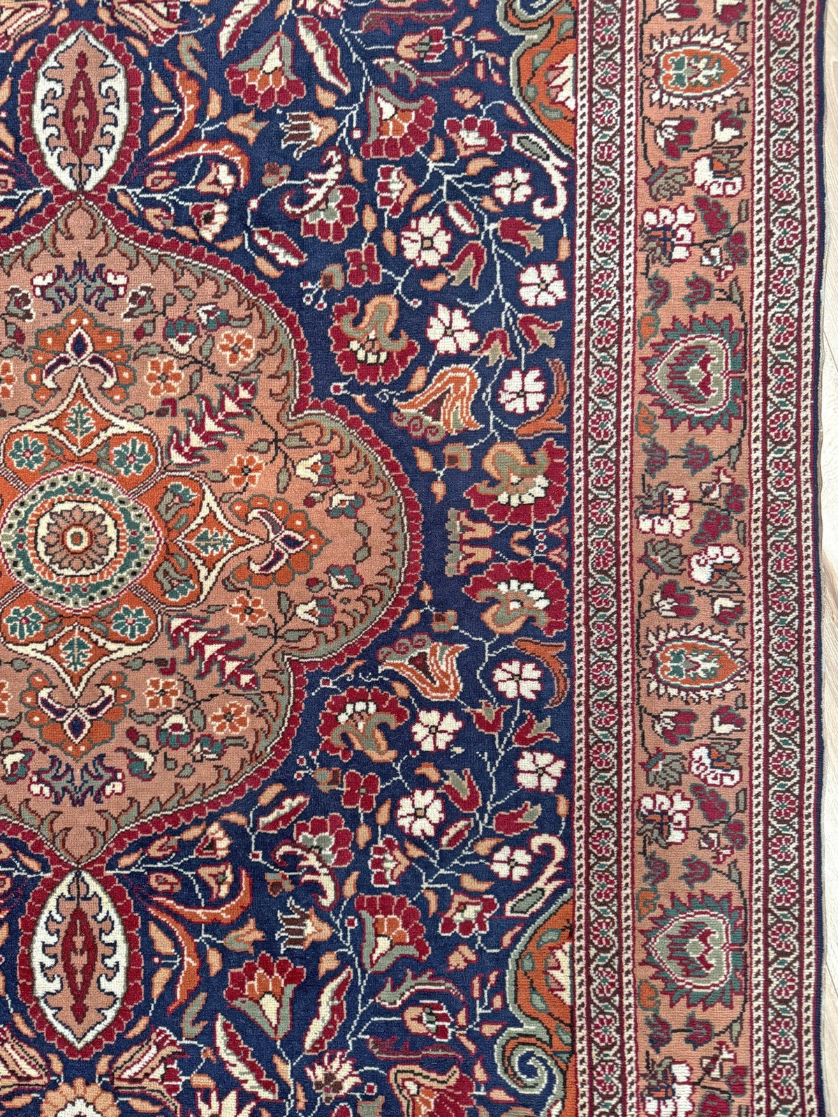 5x7 Navy Kayseri Turkish rug with peach medallion, floral vines, handmade wool from Indigo Rugs Burlingame Bay Area.