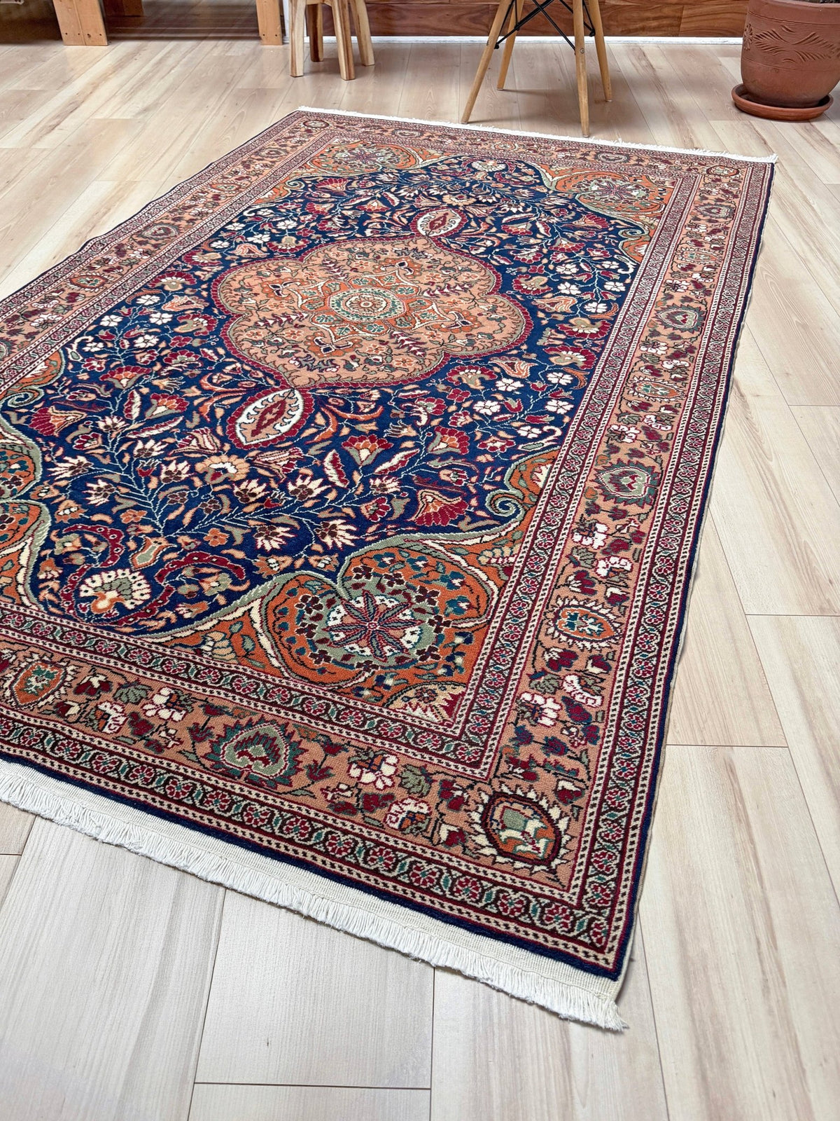 5x7 Navy Kayseri Turkish rug with peach medallion, floral vines, handmade wool from Indigo Rugs Burlingame Bay Area.