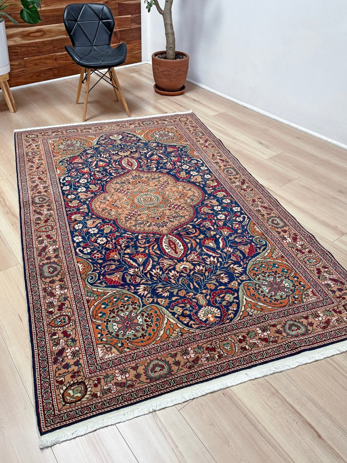 5x7 Navy Kayseri Turkish rug with peach medallion, floral vines, handmade wool from Indigo Rugs Burlingame Bay Area.