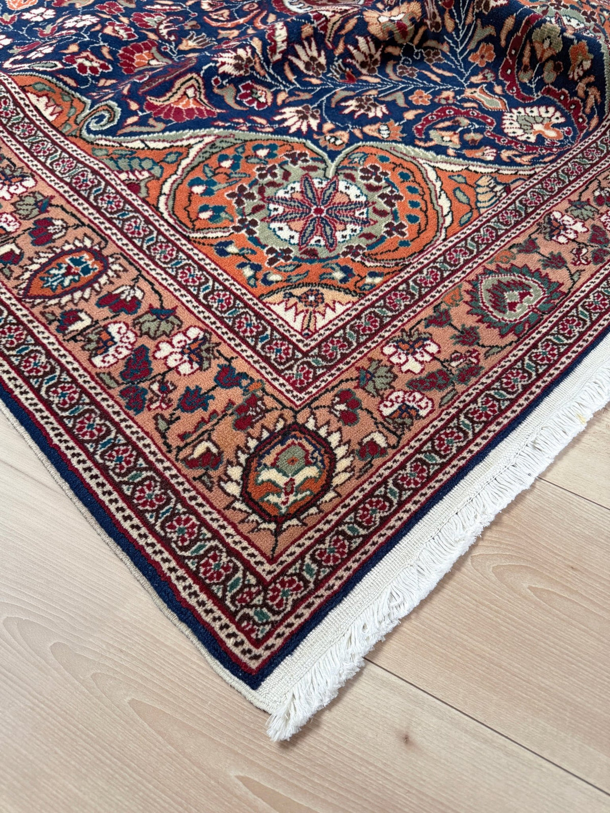 5x7 Navy Kayseri Turkish rug with peach medallion, floral vines, handmade wool from Indigo Rugs Burlingame Bay Area.