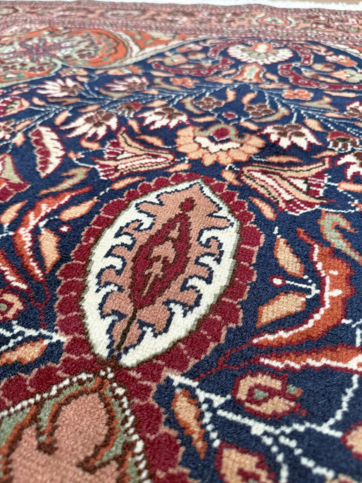 5x7 Navy Kayseri Turkish rug with peach medallion, floral vines, handmade wool from Indigo Rugs Burlingame Bay Area.