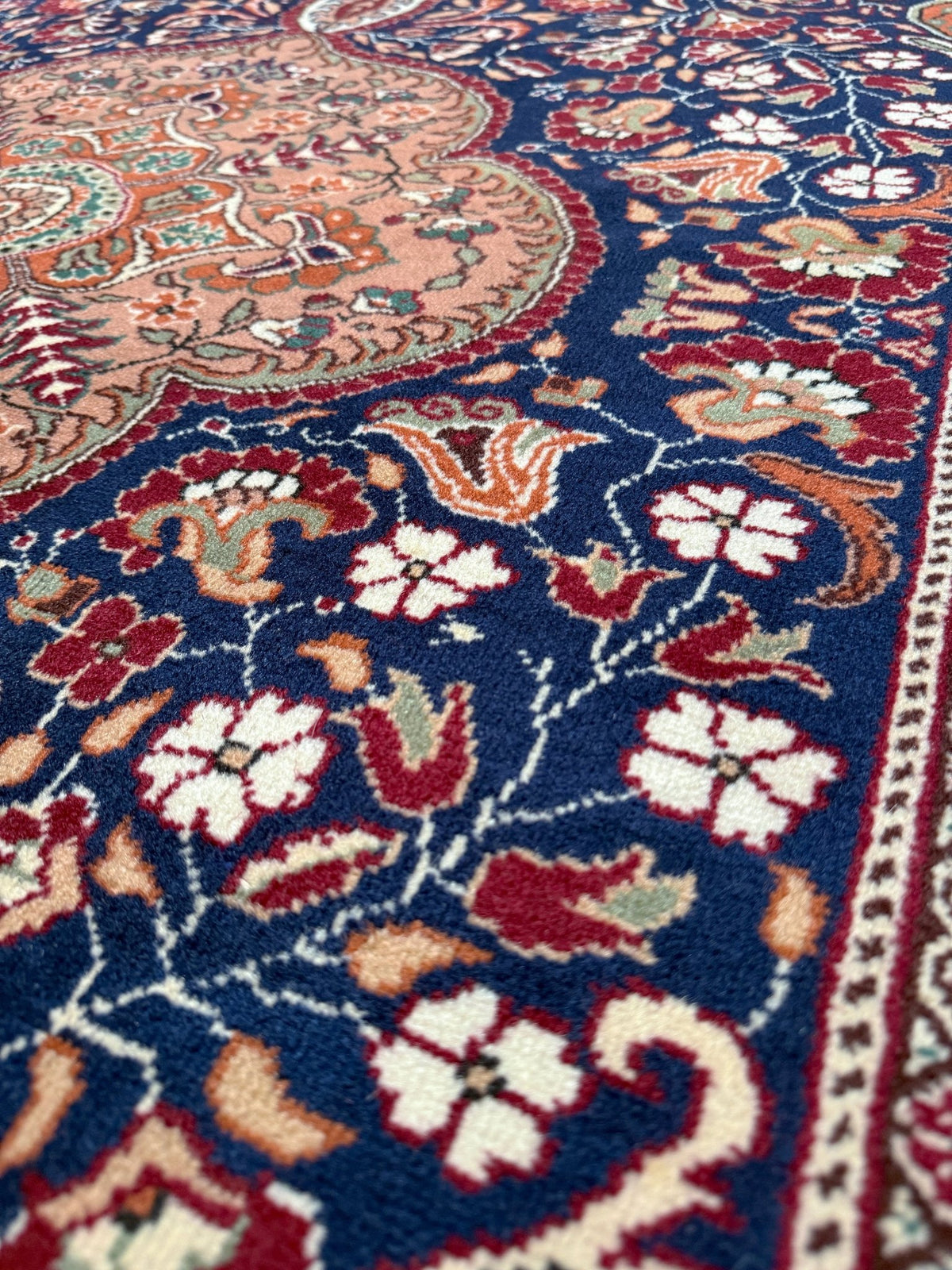 5x7 Navy Kayseri Turkish rug with peach medallion, floral vines, handmade wool from Indigo Rugs Burlingame Bay Area.