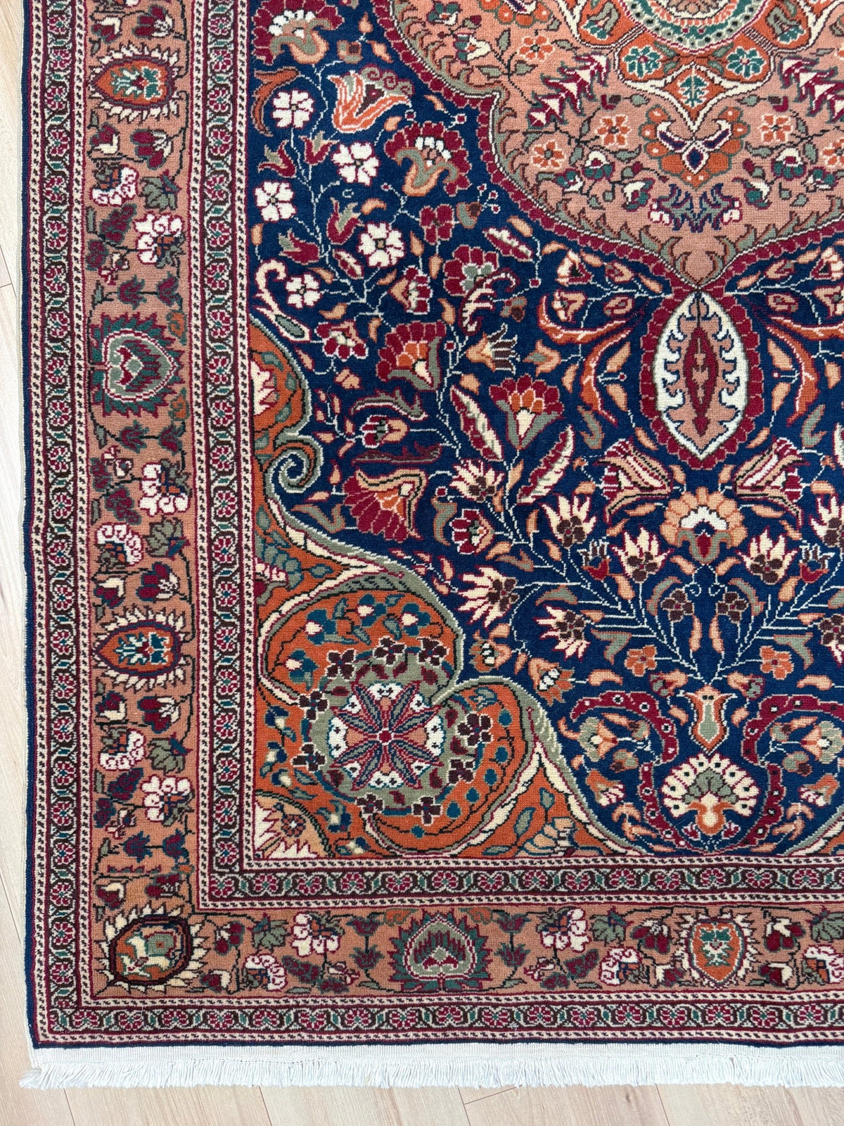 5x7 Navy Kayseri Turkish rug with peach medallion, floral vines, handmade wool from Indigo Rugs Burlingame Bay Area.