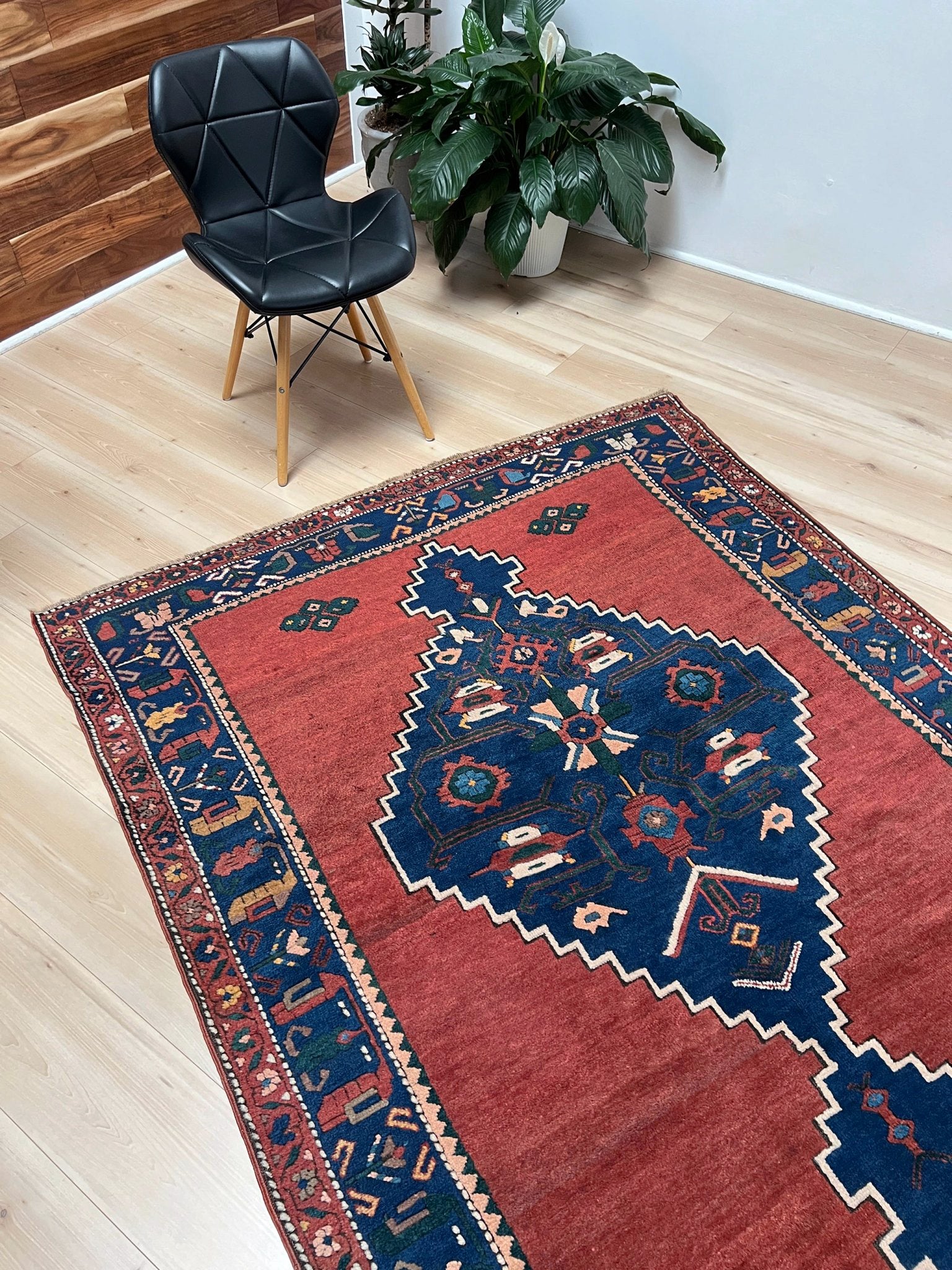 5x7 Vintage Caucasian scatter rug with a terracotta field and a bold midnight blue geometric medallion, accented with melon, ivory, and baby blue motifs. From  the best rug shop san francisco bay area Burlingame CA free shiping