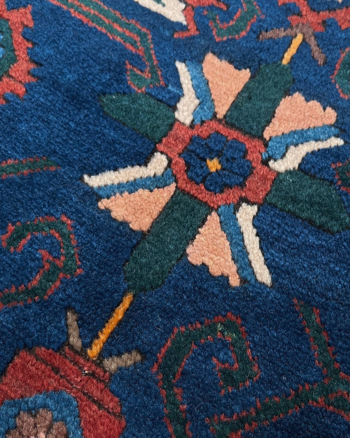 5x7 Vintage Caucasian scatter rug with a terracotta field and a bold midnight blue geometric medallion, accented with melon, ivory, and baby blue motifs. From  the best rug shop san francisco bay area Burlingame CA free shiping