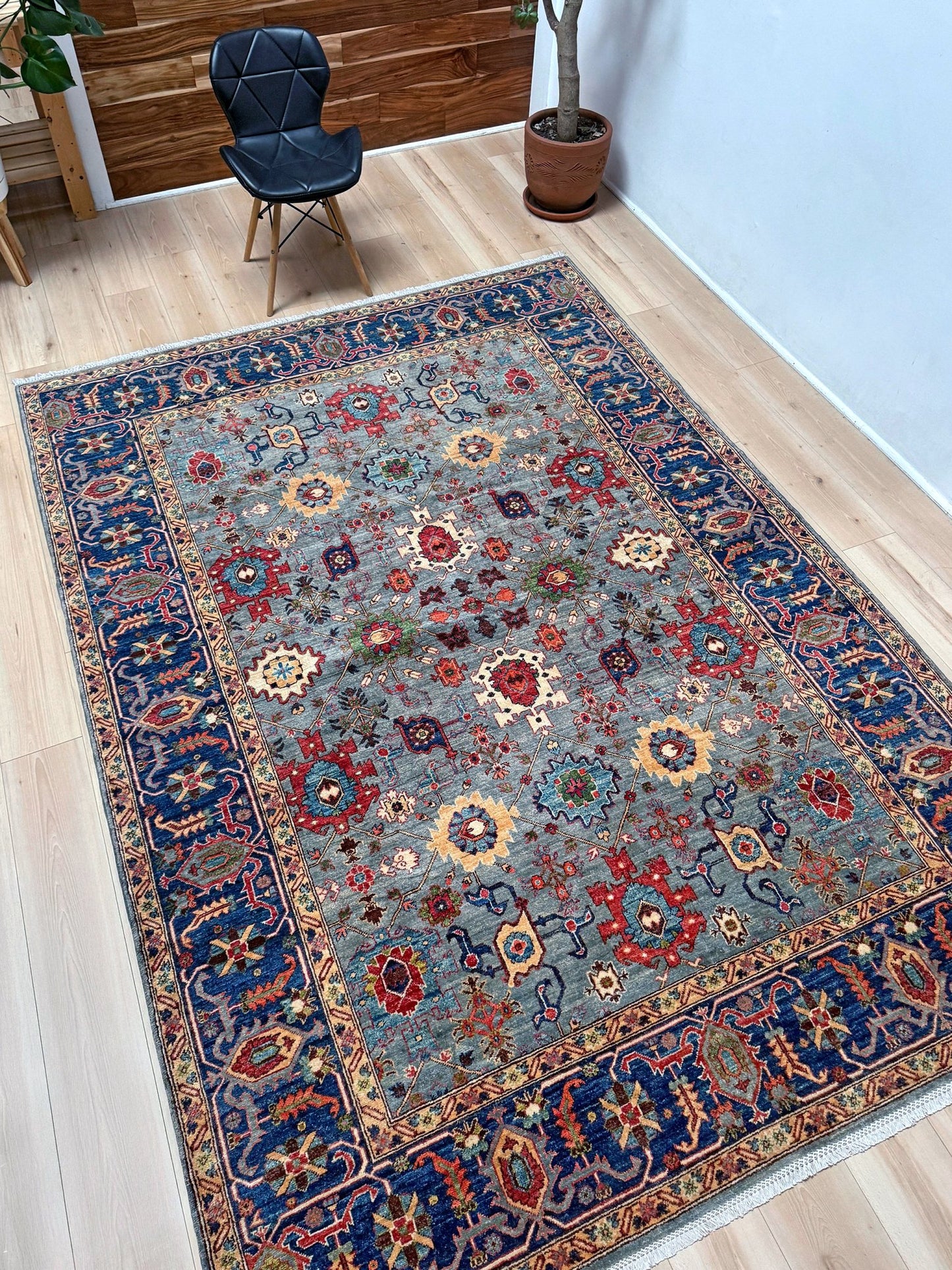 7x9 Fine handmade Ghazni wool Bijar rug with dusty blue, navy, and brick red tones, available at a rug shop in the San Francisco Bay Area. Perfect for living room, bedroom, or dining spaces. High-quality, durable Persian wool carpet with intricate floral and geometric motifs. Free shipping.