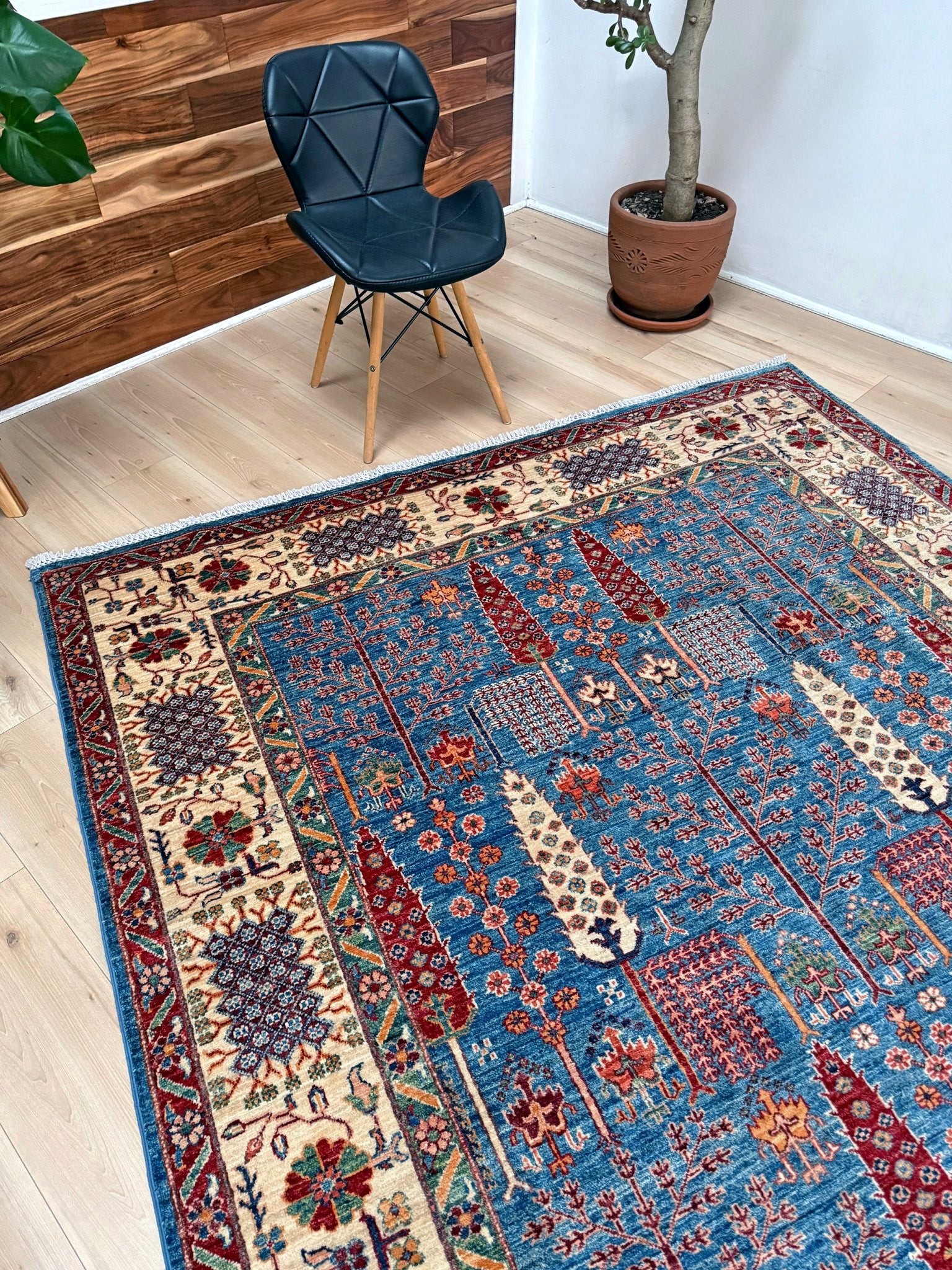 6x9 Luxury Tree of Life rug made of high-quality Ghazni wool, featuring a rich sapphire blue background with intricate floral and cypress tree motifs. Handmade and durable, perfect for the bedroom, living room, or dining area. Available from the best rug shop in San Mateo, SF Bay Area, with free shipping.