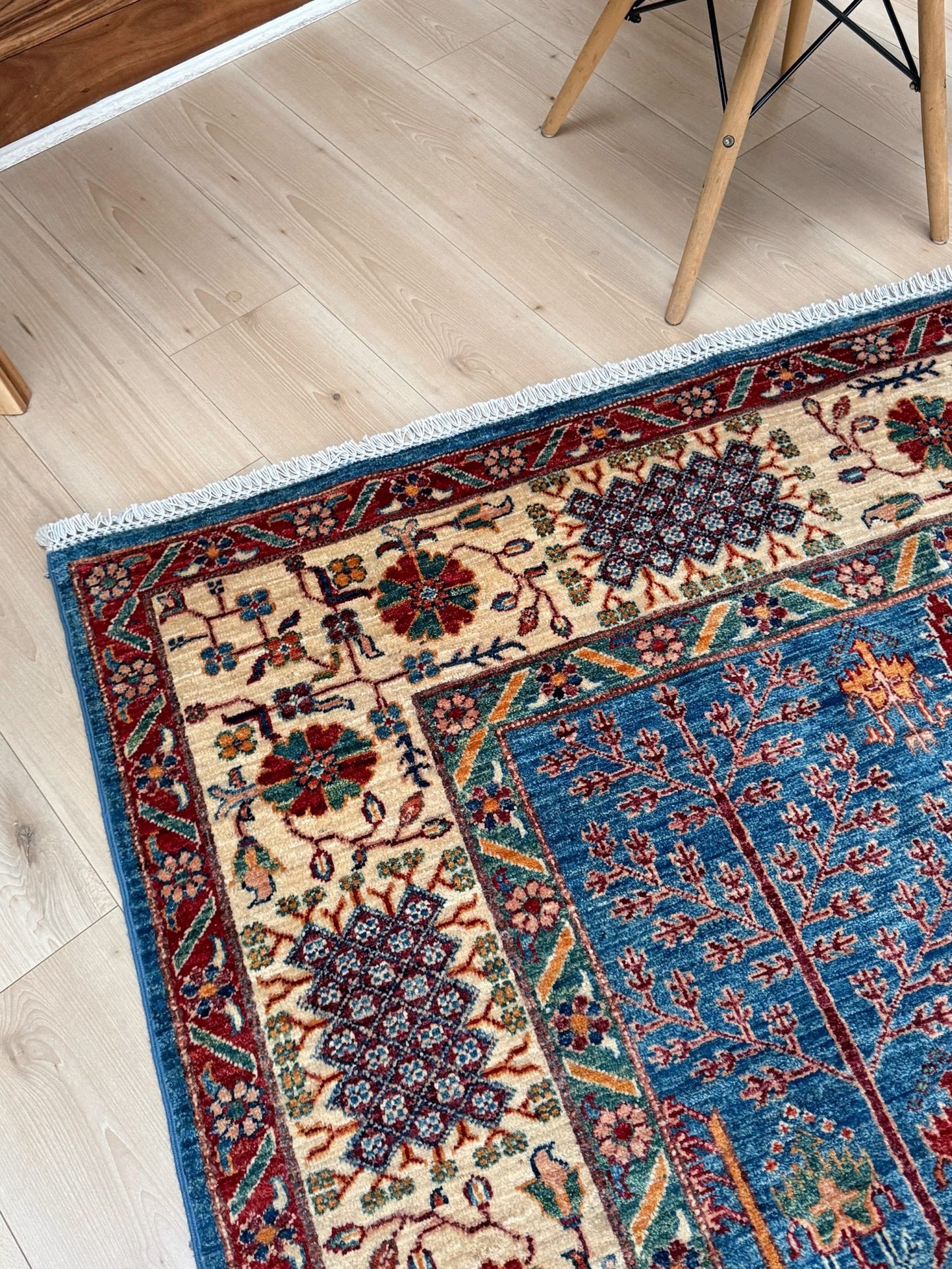 6x9 Luxury Tree of Life rug made of high-quality Ghazni wool, featuring a rich sapphire blue background with intricate floral and cypress tree motifs. Handmade and durable, perfect for the bedroom, living room, or dining area. Available from the best rug shop in San Mateo, SF Bay Area, with free shipping.