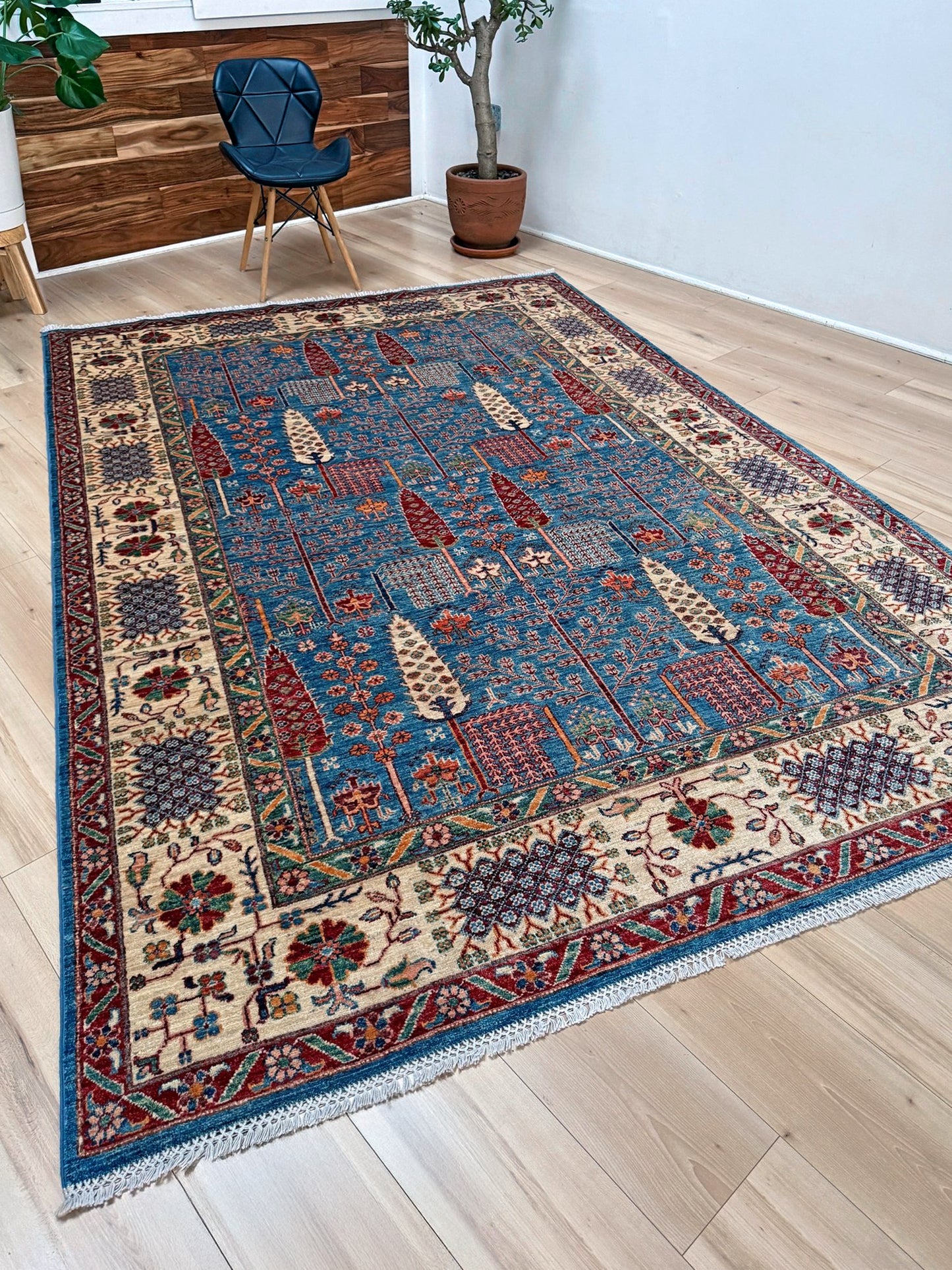 6x9 Luxury Tree of Life rug made of high-quality Ghazni wool, featuring a rich sapphire blue background with intricate floral and cypress tree motifs. Handmade and durable, perfect for the bedroom, living room, or dining area. Available from the best rug shop in San Mateo, SF Bay Area, with free shipping.