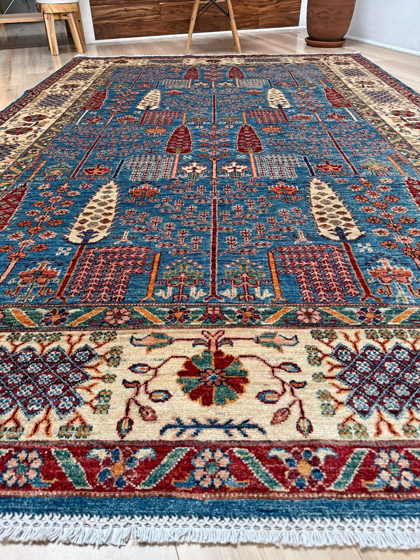 6x9 Luxury Tree of Life rug made of high-quality Ghazni wool, featuring a rich sapphire blue background with intricate floral and cypress tree motifs. Handmade and durable, perfect for the bedroom, living room, or dining area. Available from the best rug shop in San Mateo, SF Bay Area, with free shipping.