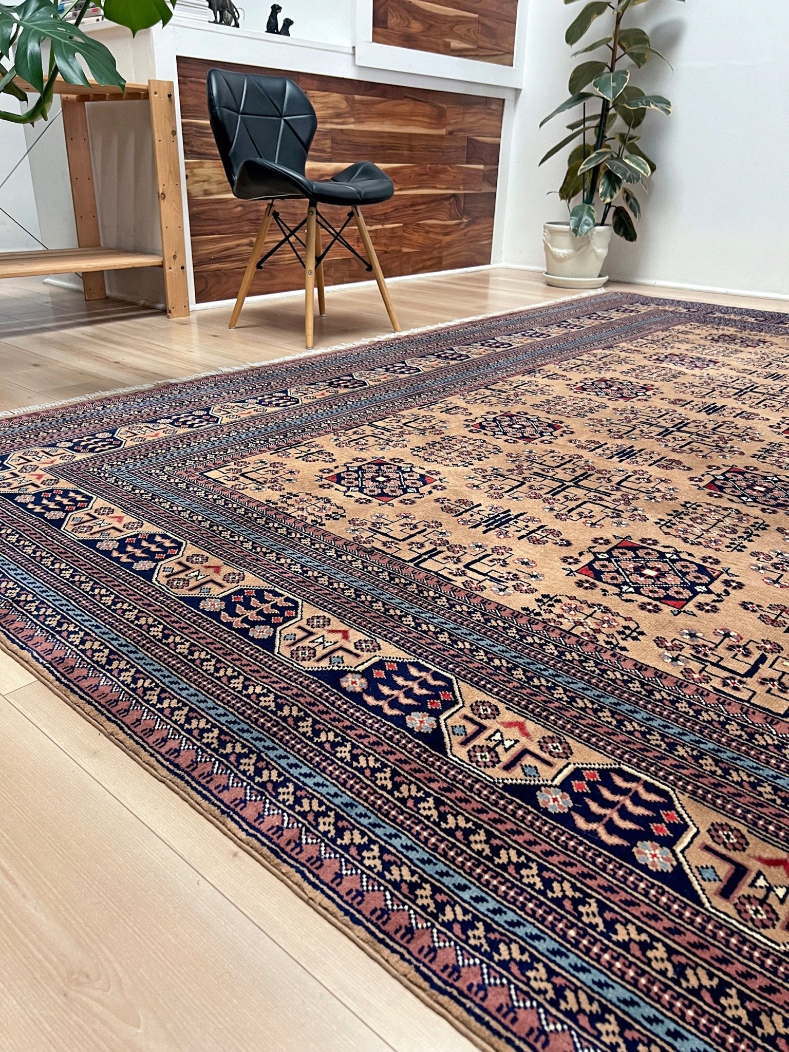 Side view of Sand Bilcik Turkmen wool area rug with intricate medallion motifs and ornate indigo and rust borders, perfect for living room, bedroom, or dining room decor. Sold by the best handmade luxury rug shop in the San Francisco Bay Area.