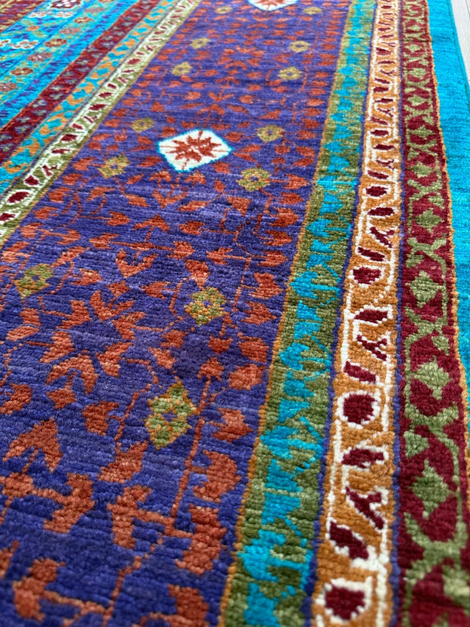 45x45 Top-quality 8x10 Sultanate Mamluk rug from the best rug shop in San Mateo, SF Bay Area. It features rich turquoise, royal purple, and saffron hues with intricate geometric patterns. Perfect for a bedroom, living room, or dining space, adding character and timeless elegance. Free shipping available.